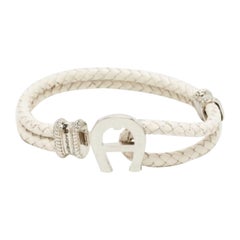 Bracciale Aigner in pelle intrecciata con tonalità argento