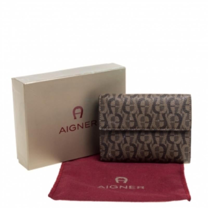 This French wallet from Aigner is crafted from the signature coated canvas. It is designed with multiple credit card slots and slip compartments for the cash. This wallet can easily slip into any of the label's chic handbags.