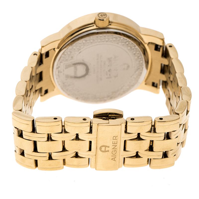 Aigner is considered the first voguish brand for stylish living from Germany. This champagne gold plated stainless steel women's wristwatch by Aigner is a fashionable example of the aforementioned. The watch features a fancy round bezel with