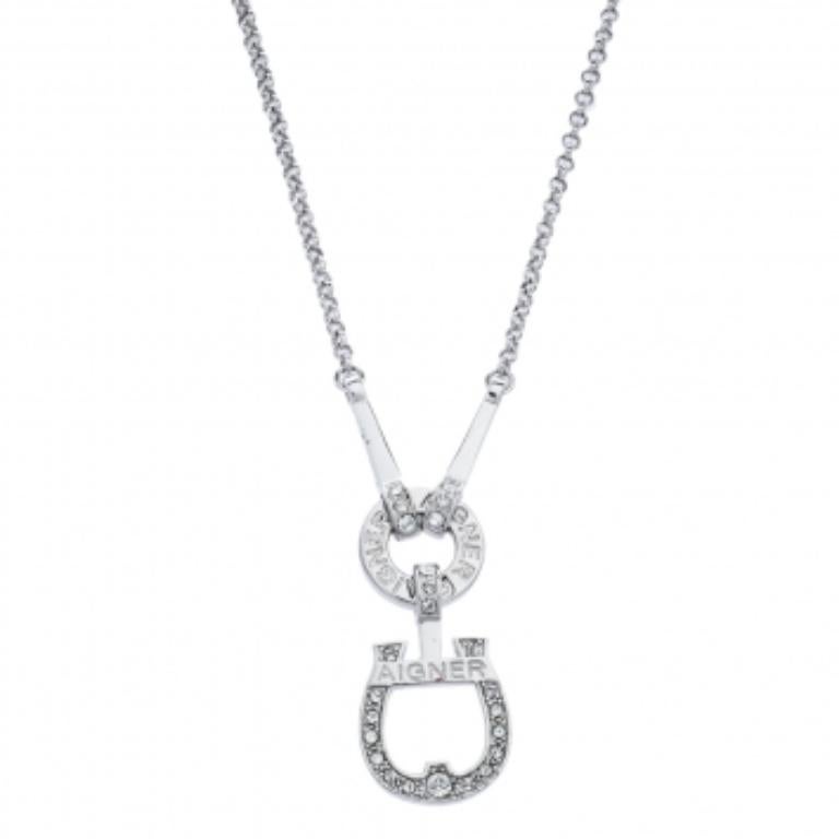 We can't stop admiring this beauty from Aigner! Beautifully crafted from silver-tone metal, this necklace is a stunner. It has been styled with a crystal-decorated logo pendant. The pendant is held by a chain and is complete with a lobster clasp.
