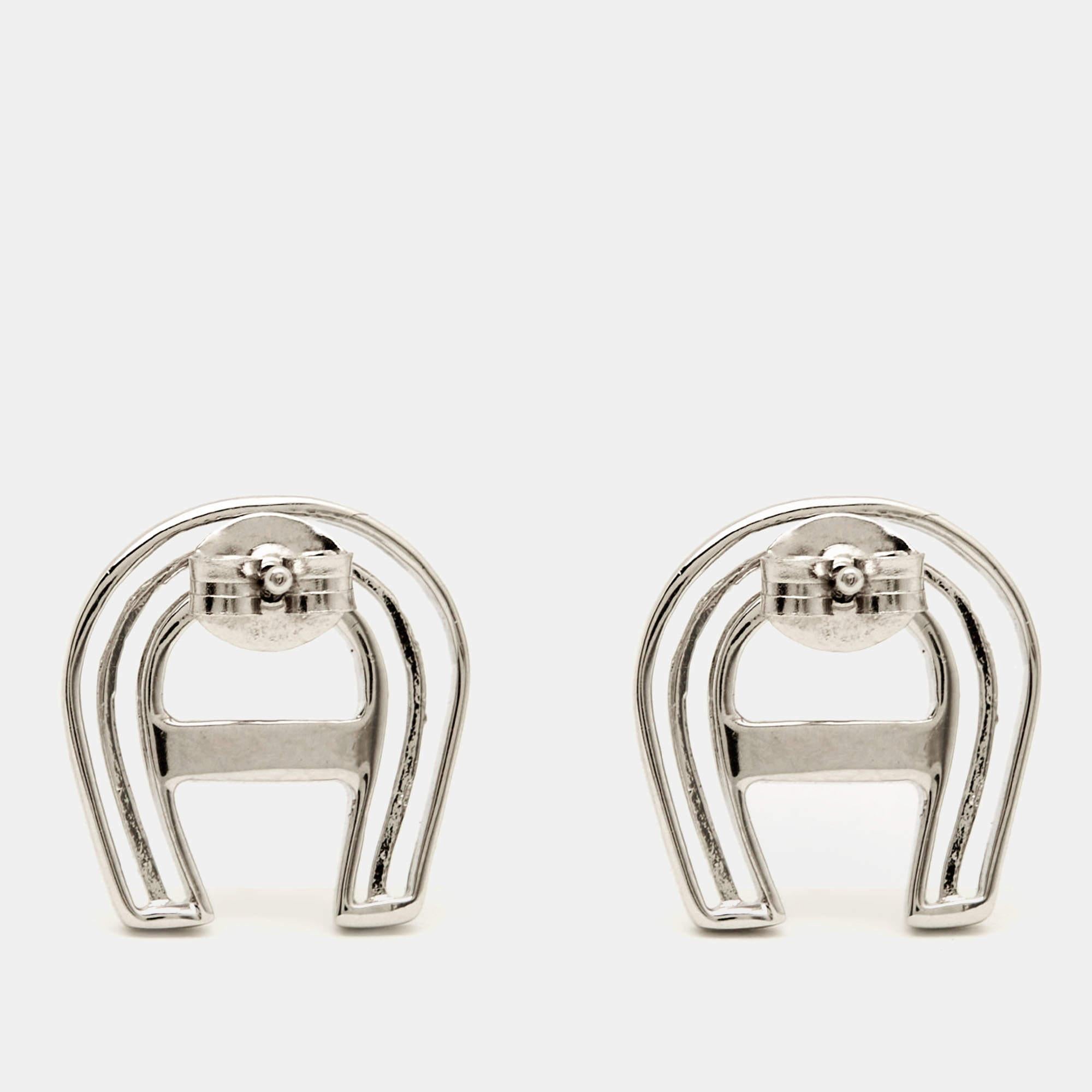 Complete a chic outfit with this pair of Aigner earrings. The design is meticulously crafted as the brand's logo for a signature appeal.

Includes: Original Pouch

