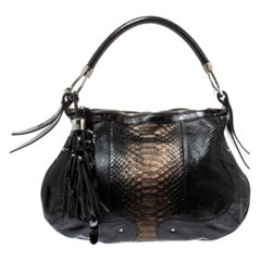 Aigner ha una borsa con nappe in pitone e vernice marrone scuro