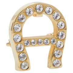 Spilla con logo di Aigner in cristallo in tonalità oro