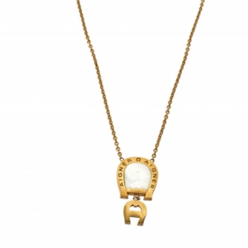 This beautiful necklace from Aigner is effortlessly chic and also subtly glamorous for both day and night. Crafted using gold-tone metal, the chain holds a Mother of Pearl-embedded pendant, and a small A logo set with crystals for a hint of sparkle.