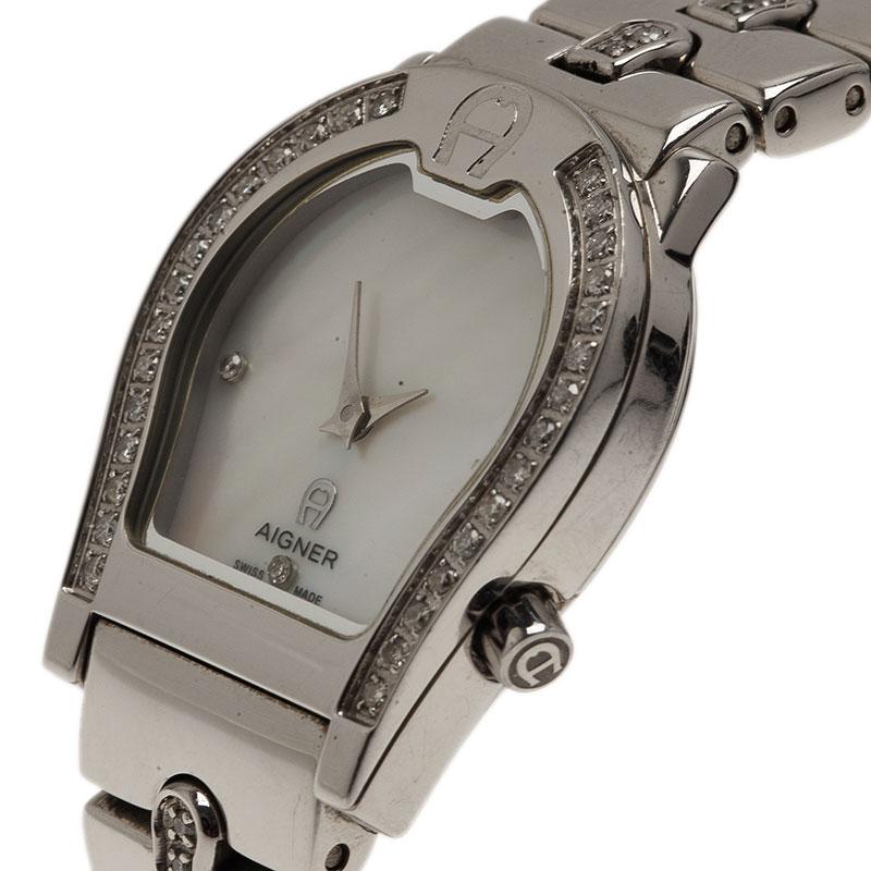 Elegant and chic, this timepiece from Aigner is a stunner from the signature Verona collection. Made from stainless steel, it features a Mother of Pearl dial. The case is designed with an A-shaped bezel embellished with diamonds and matched with