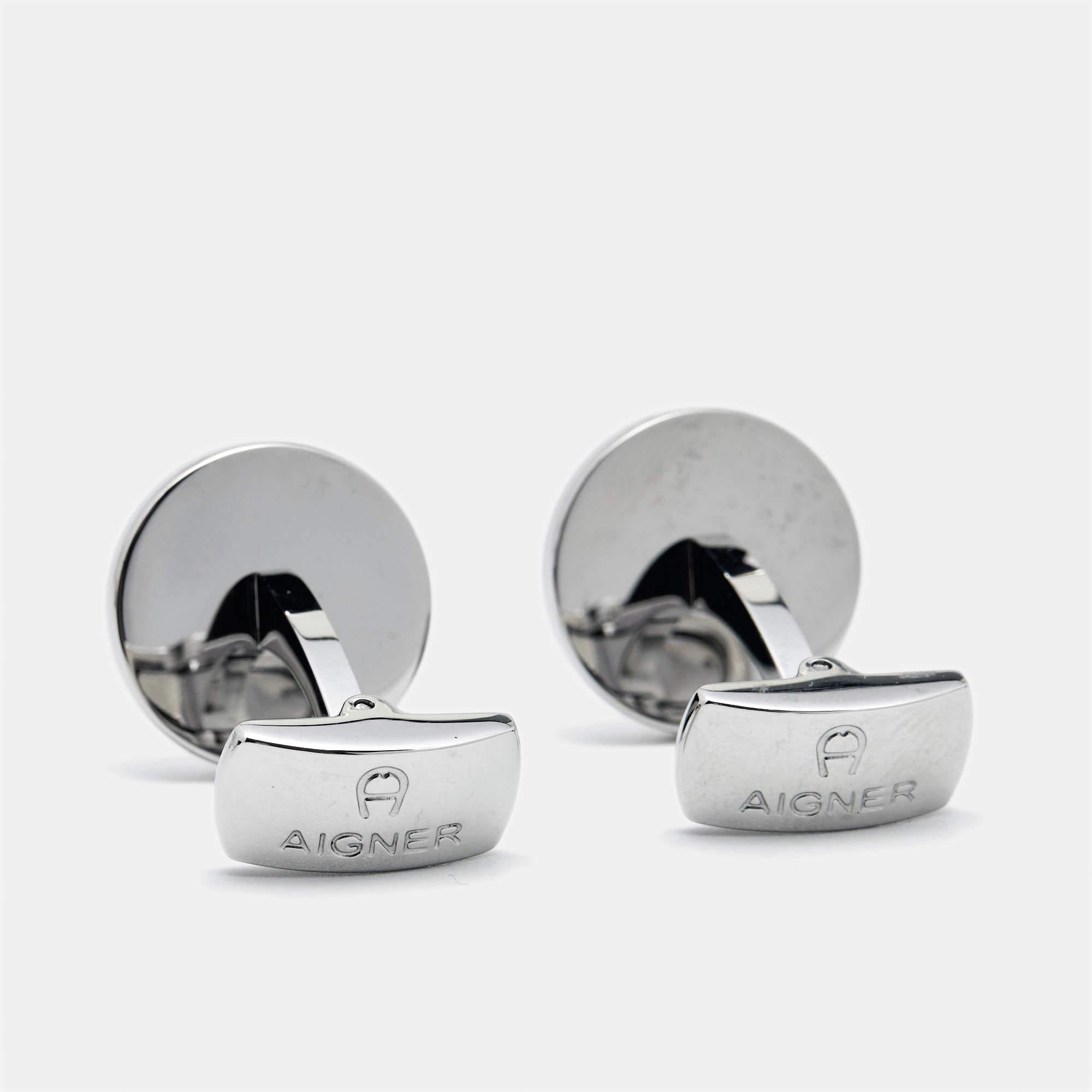 Perfect accessory for men, cufflinks add a touch of elegant appeal to formal ensembles. This one from Aigner will be your favorite.

Includes: Original Box

