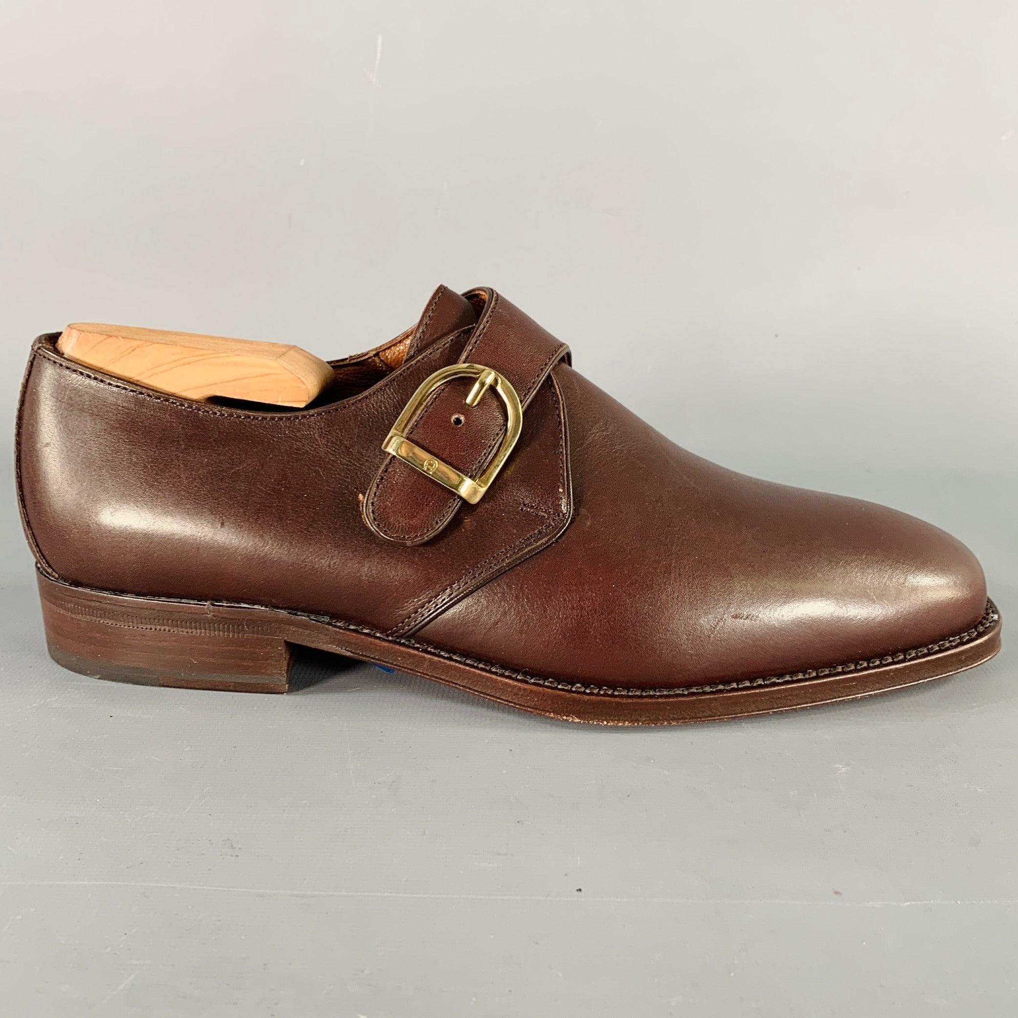 AIGNER shoes
in a brown leather featuring a gold tone metal monk strap closure. Shoe trees not included. Made in Italy.New without Box. 

Marked:   112462 14 39.5 8Outsole: 10.25 x 3.75 inches 
  
  
 
Sui Generis Reference: 135893
Category: