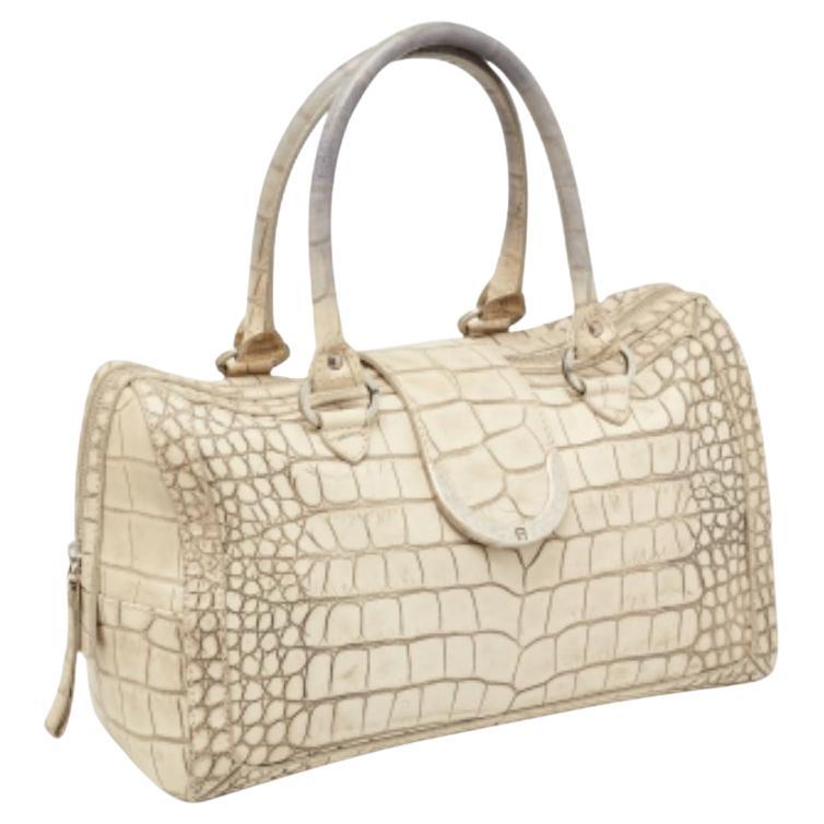 Cartera Aigner Vainilla/Negra Piel de Cocodrilo con Solapa en venta