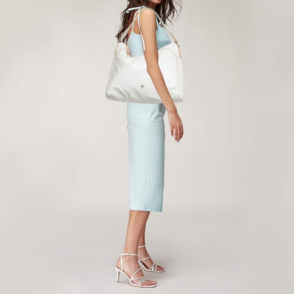 Ensure your days essentials are in order and your outfit is complete with this Aigner bag. Crafted using the best materials the bag carries the maisons signature of artful craftsmanship and enduring appeal.
