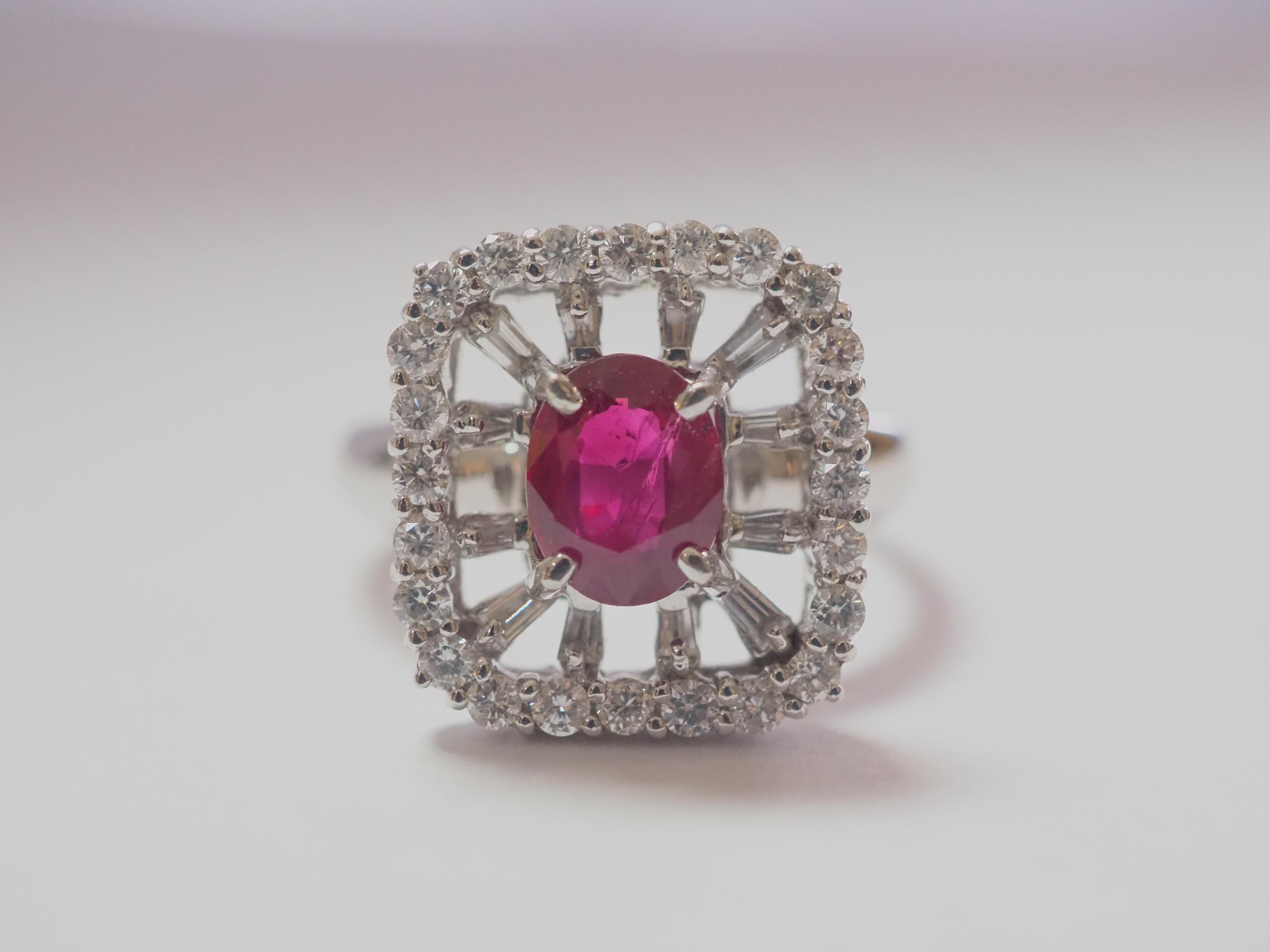 SOLD- 

Beautiful and peak unique cocktail ring boasts a lovely oval ruby at the center! The ruby is an oval cut and is bright with high saturation of color and with natural inclusions. There are numerous tapered baguette and round melee diamonds