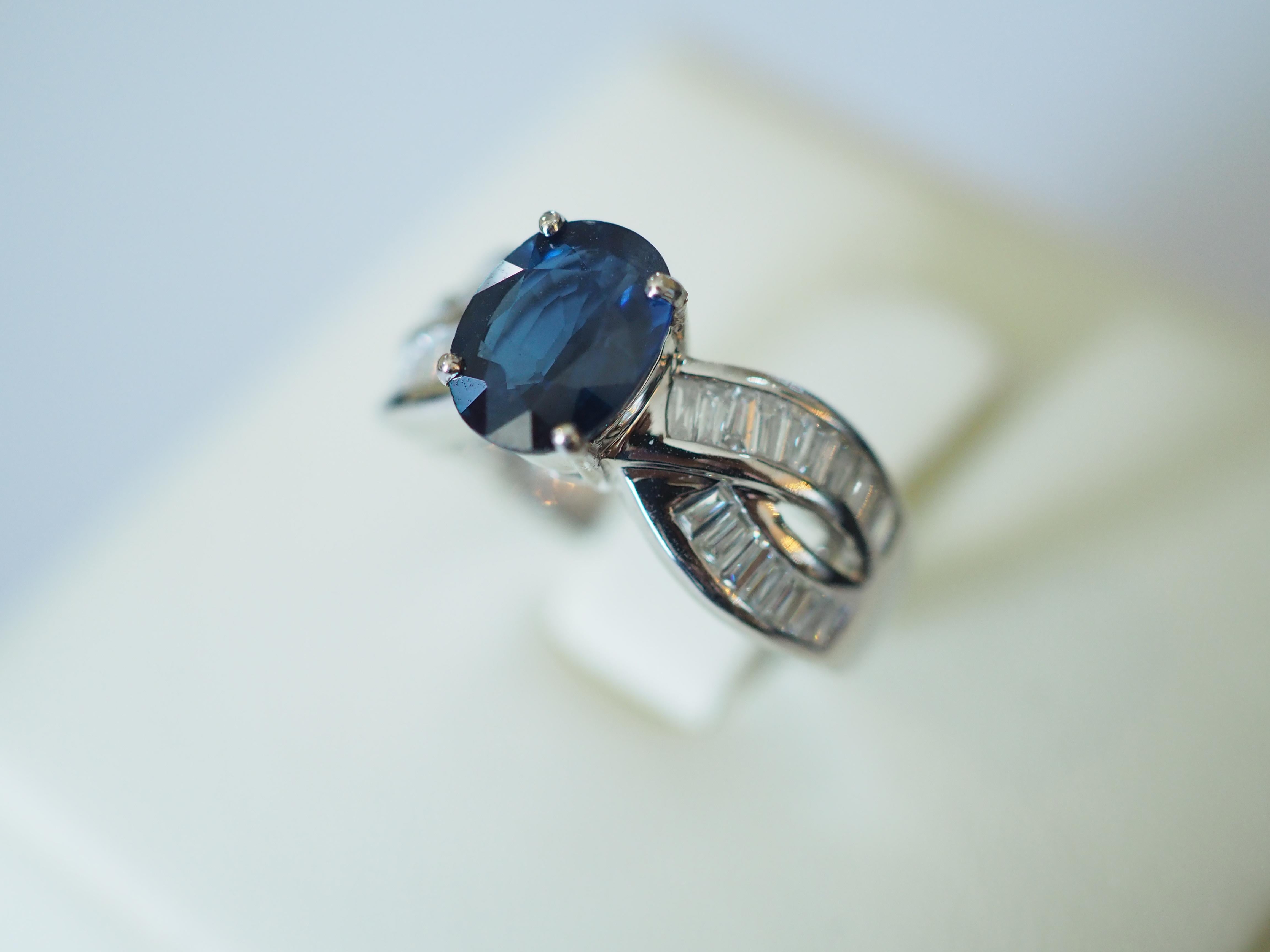  This beautiful engagement piece is a beautiful 18K white gold fine Thai blue sapphire and baguette diamond ring! The piece is accompanied by Vintage 2005 AIGS report #SO0512272 of the wonderful sapphire. There are numerous pieces baguette and
