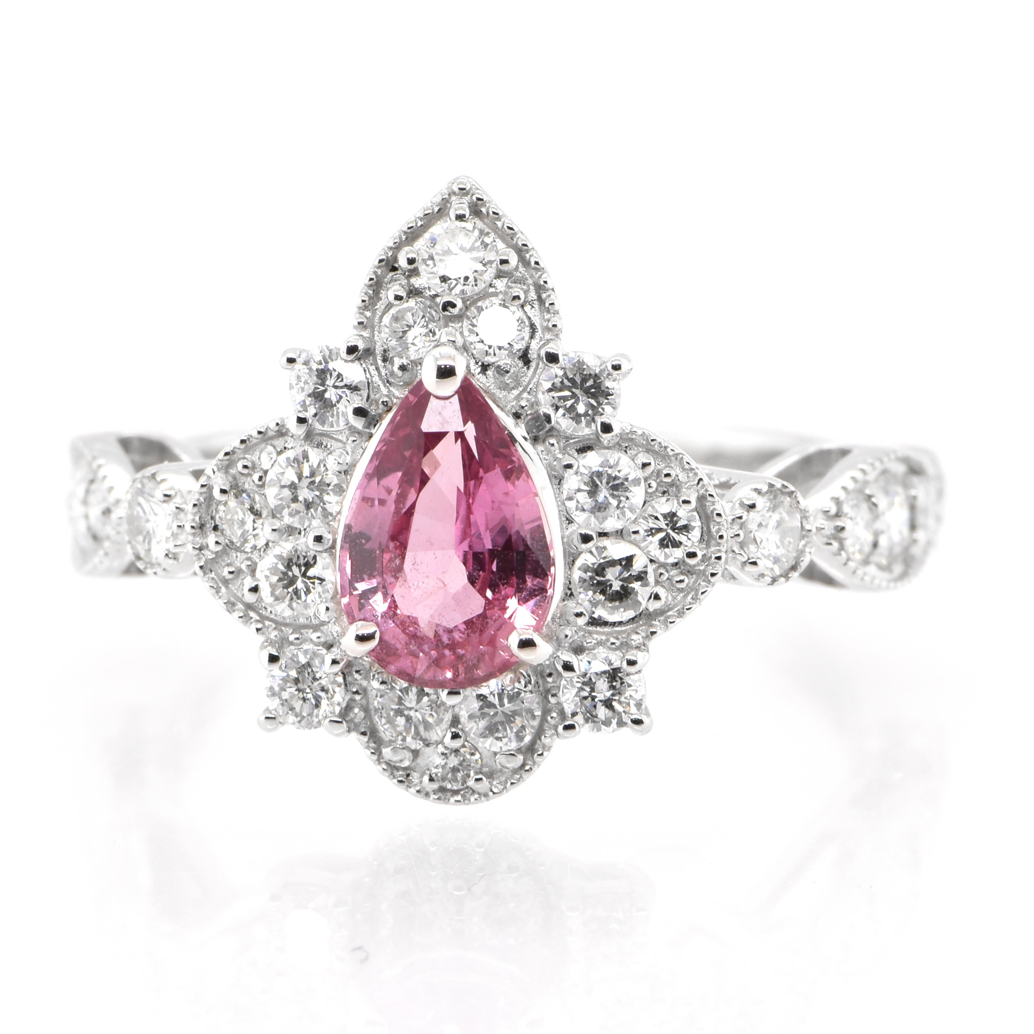 A beautiful ring featuring a AIGS Certified 0.98 Carat Natural Padparadscha Sapphire and 0.77 Carats of Diamond Accents set in Platinum. Sapphires have extraordinary durability - they excel in hardness as well as toughness and durability making them