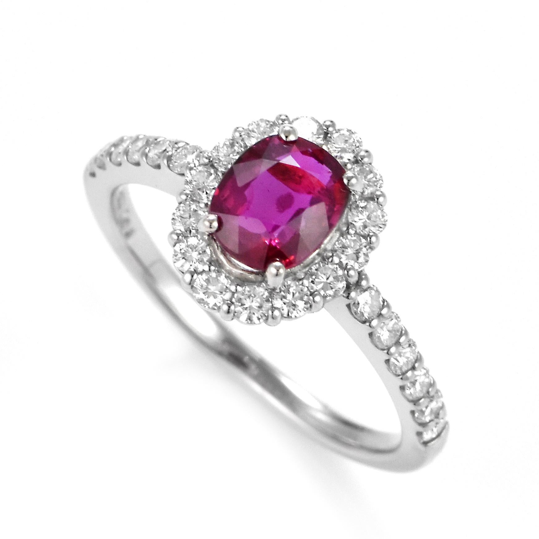 A beautiful Ring set in Platinum featuring a AIGS Certified 1.03 Carat Natural No Heat, Pigeon Blood Ruby and 0.48 Carat Diamonds. Rubies are referred to as 