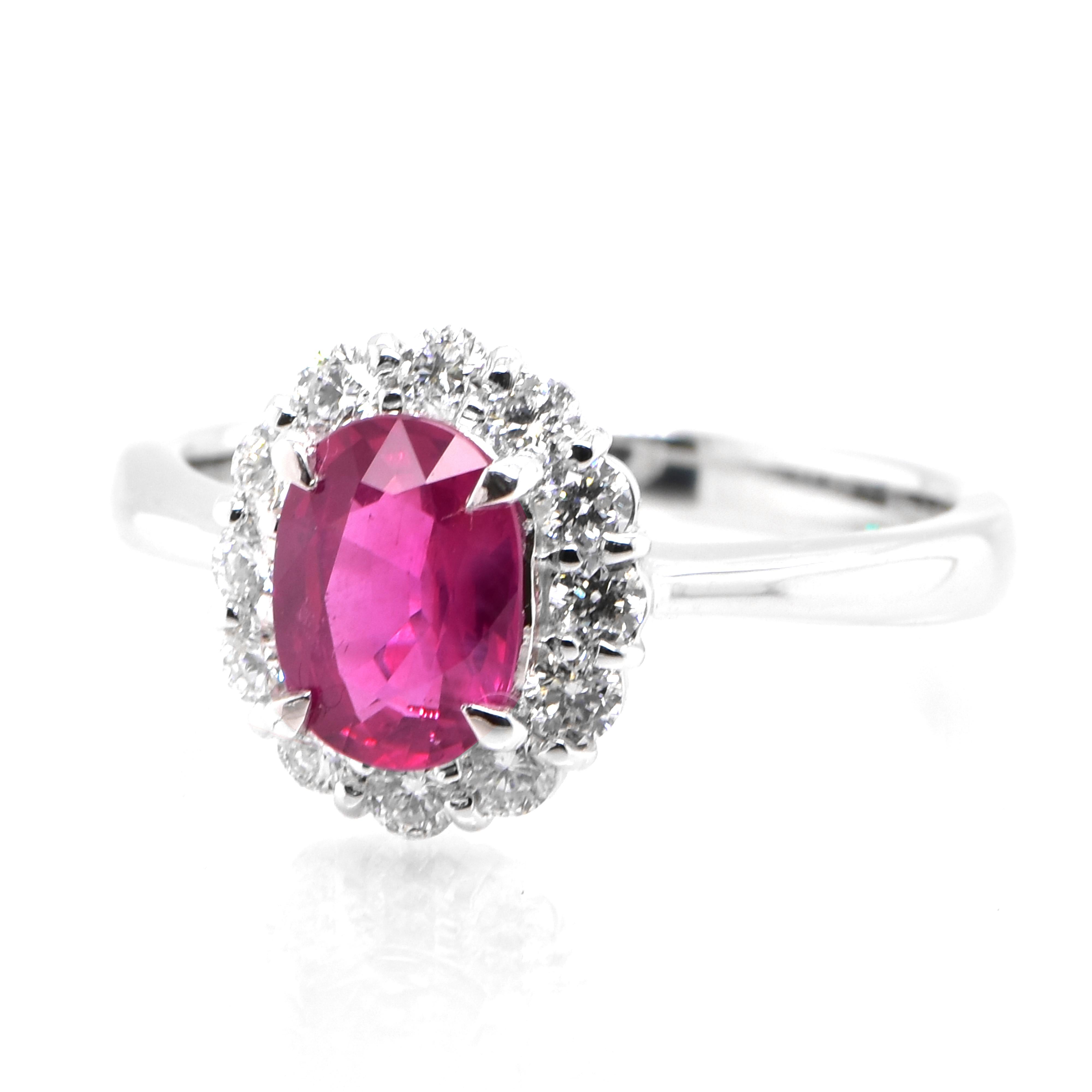 A beautiful Ring set in Platinum featuring a AIGS Certified 1.17 Carat Natural, Untreated (No Heat), Pigeon Blood Ruby and 0.41 Carat Diamonds. Rubies are referred to as 