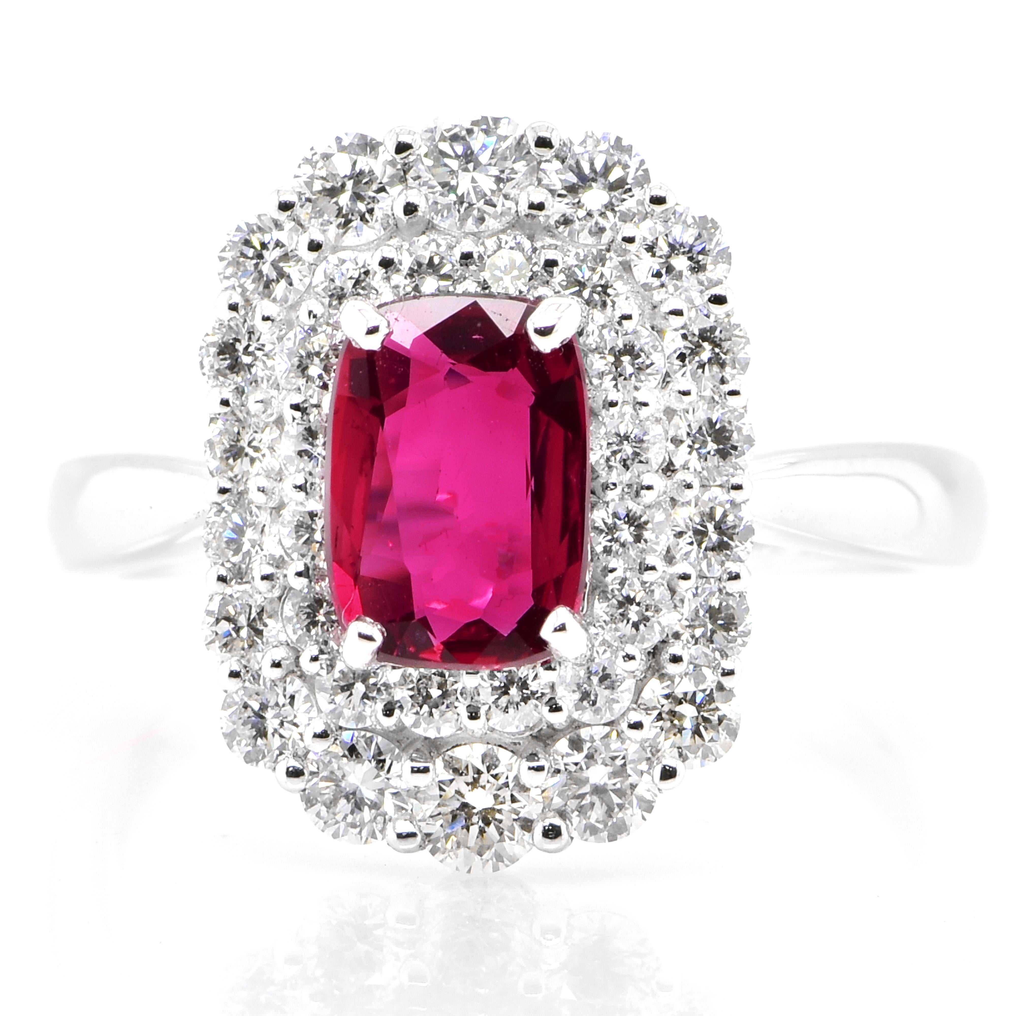 A beautiful Ring set in Platinum featuring a AIGS Certified 1.20 Carat Natural, Untreated (No Heat), Pigeon Blood Ruby and 0.92 Carat Diamonds. Rubies are referred to as 