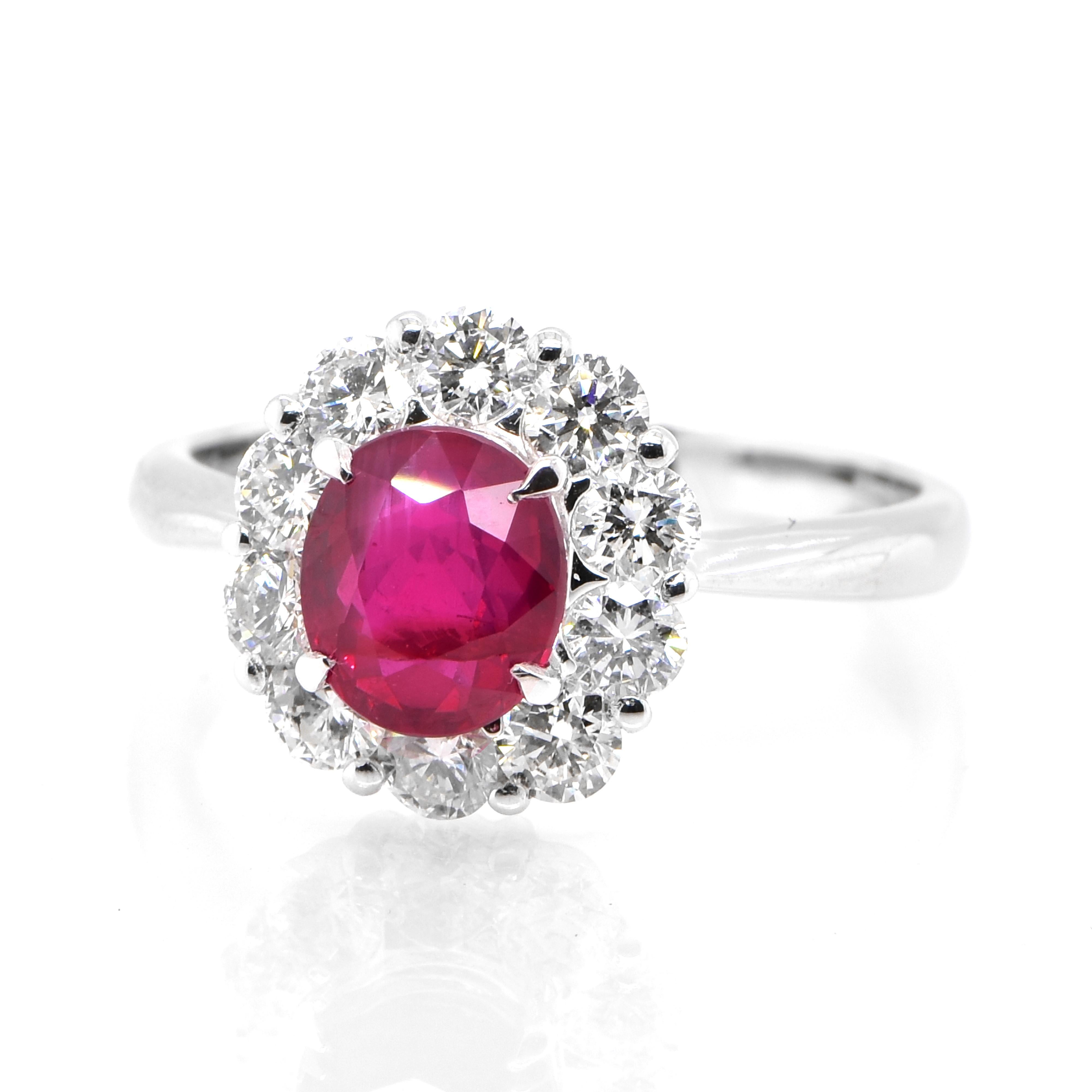 A beautiful Ring set in Platinum featuring a AIGS Certified 1.39 Carat Natural, Untreated (No Heat), Pigeon Blood Ruby and 0.80 Carat Diamonds. Rubies are referred to as 