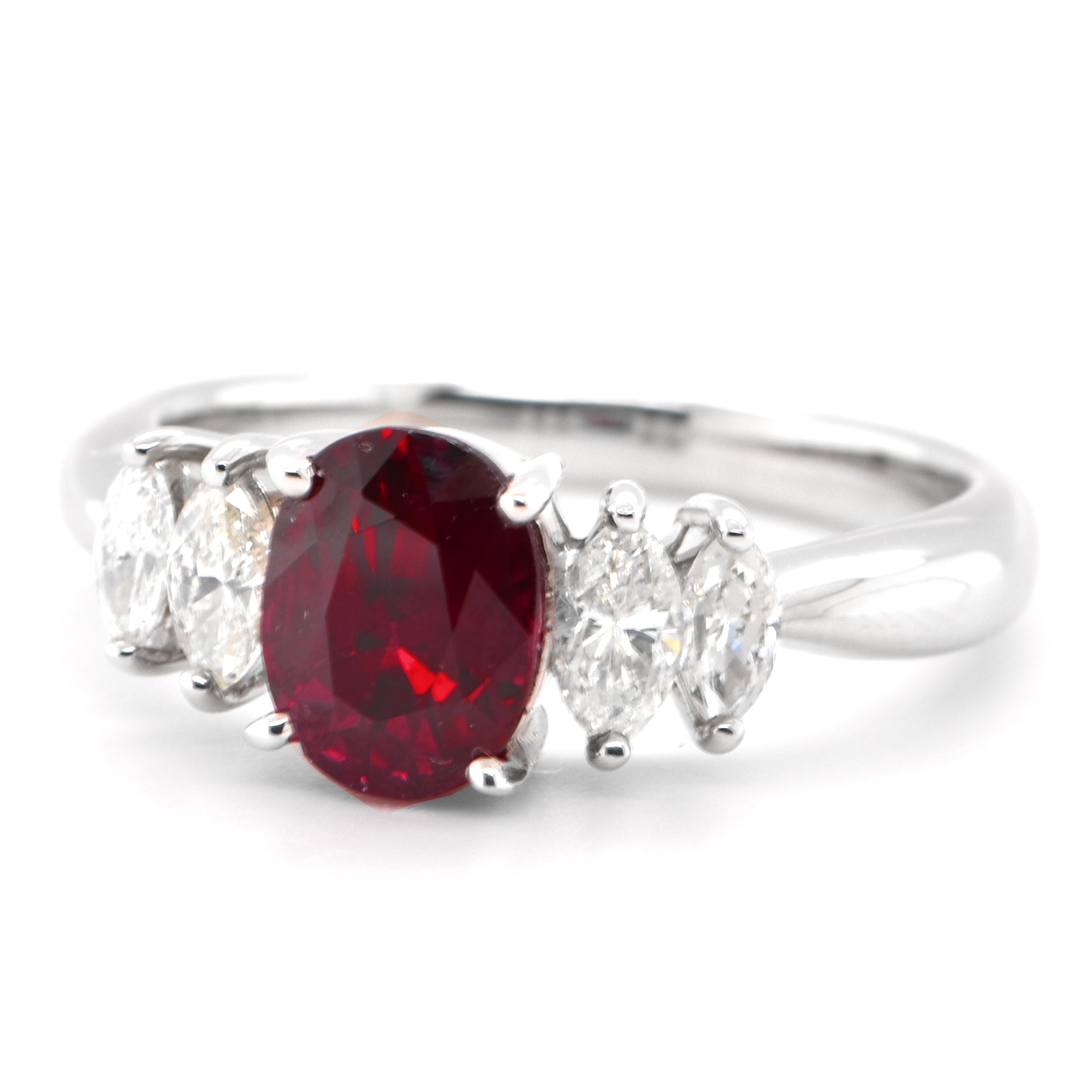 A beautiful ring set in Platinum featuring a AIGS Certified 1.96 Carat Natural Thailand Pigeon Blood Ruby and 0.70 Carat Diamond. Rubies are referred to as 