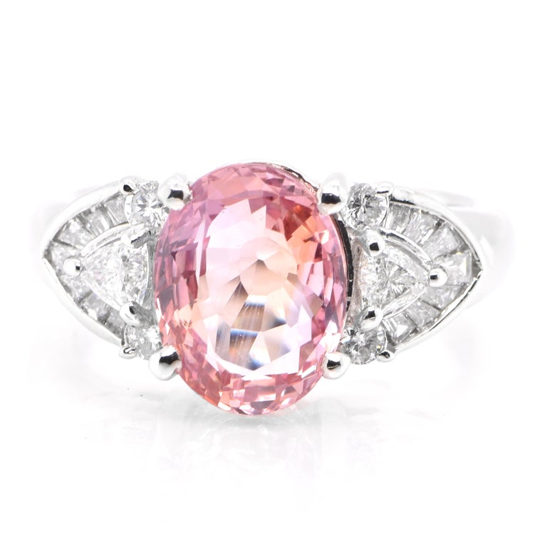 A beautiful ring featuring a AIGS Lab Certified 3.25 Carat, Natural Padparadscha Sapphire and 0.61 Carats of Diamond Accents set in Platinum. Sapphires have extraordinary durability - they excel in hardness as well as toughness and durability making