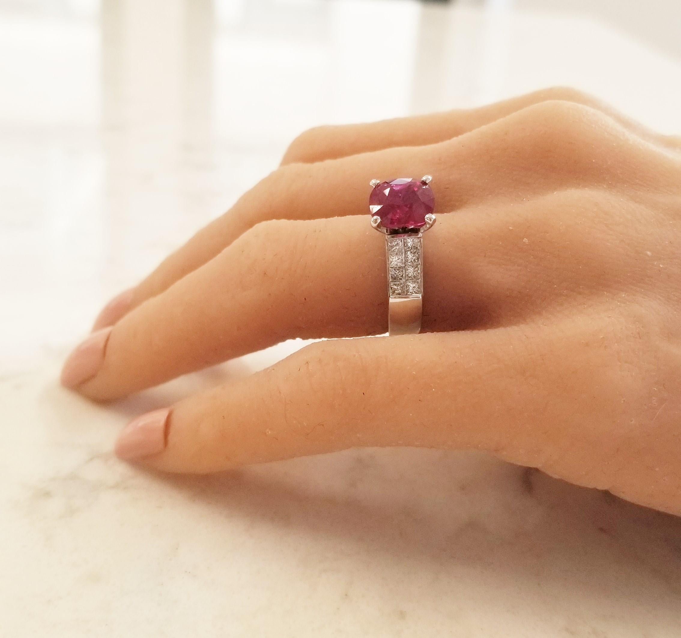 Stylish and sophisticated, this timeless royal ruby and diamond ring is utterly magnificent. No one will be able to take their eyes off the lively 4.02 Carat - 9.19 X 8.07 millimeter AIGS certified oval ruby, which is expertly paired with a double