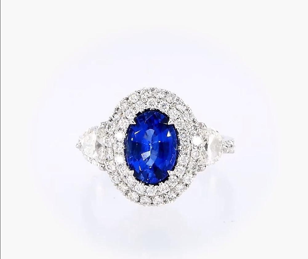 18kt white gold ruby ring with diamonds
  
  Gold colour & karat: White gold 18kt
  Weight: 5.219 grams
  
  Set with-
  Stone type: Ruby
  Shape: Oval
  Carat: 1.76 
  Colour: - 
  Clarity: -
  
  Surrounding Stones: Diamonds
 1) Side Half Moon