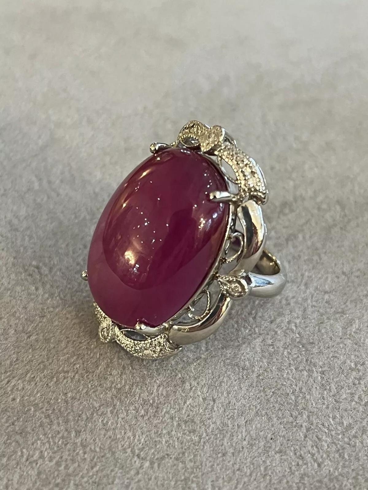 AIGS Certified Star Ruby 38.34 carats No Heat Burma Ring in Platinum

Star Ruby and Diamond Ring features an AIGS Certified natural Oval Cabochon Star Ruby weighing 38.34 carats accented with Round Diamonds and set in Platinum. 

Total star ruby