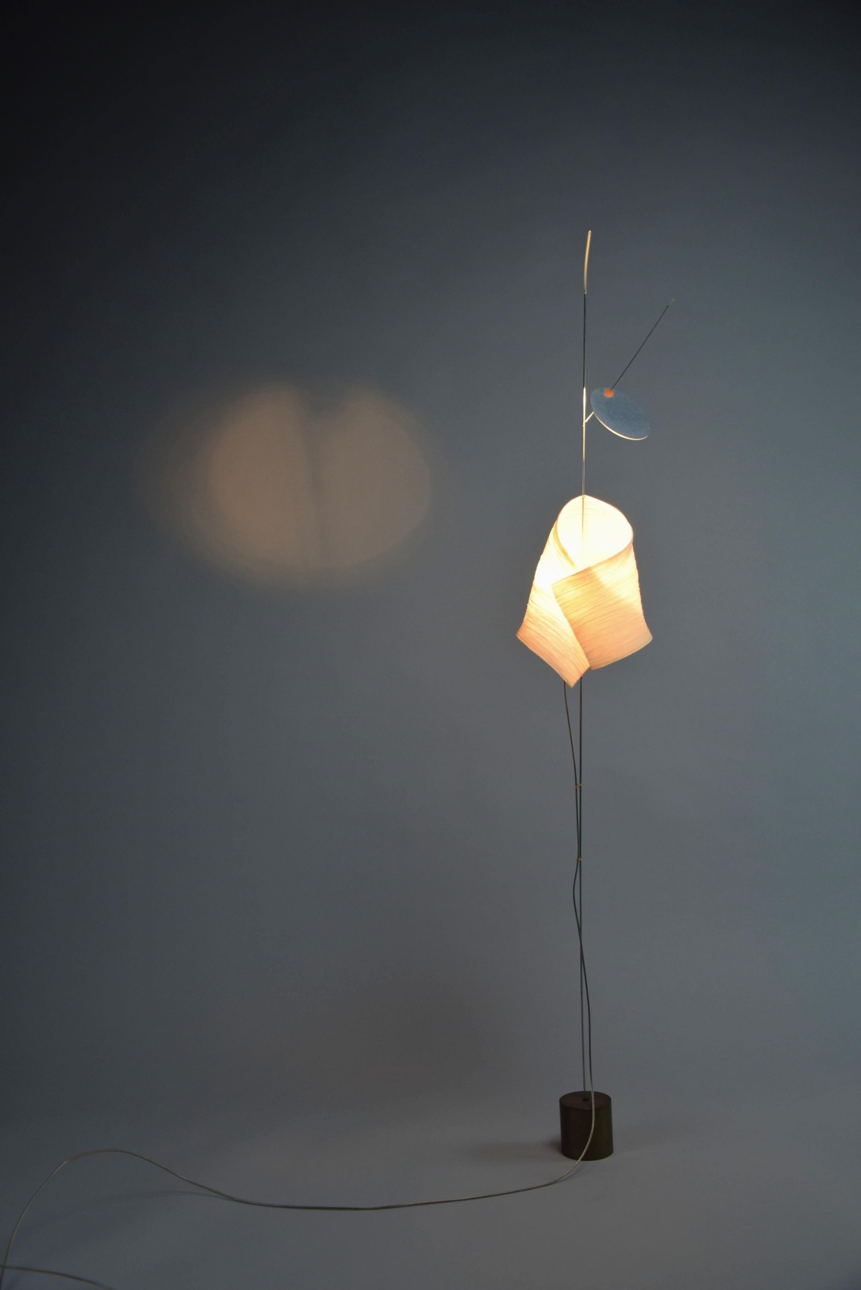 Illuminate Your Space with Distinctive Style: The 1998 Aikaduli Table Lamp

Introducing the Aikaduli Table Lamp, a luminary masterpiece born from the creative minds of Ingo Maurer and Dagmar Mombach in 1998. This lamp is not just a source of light;