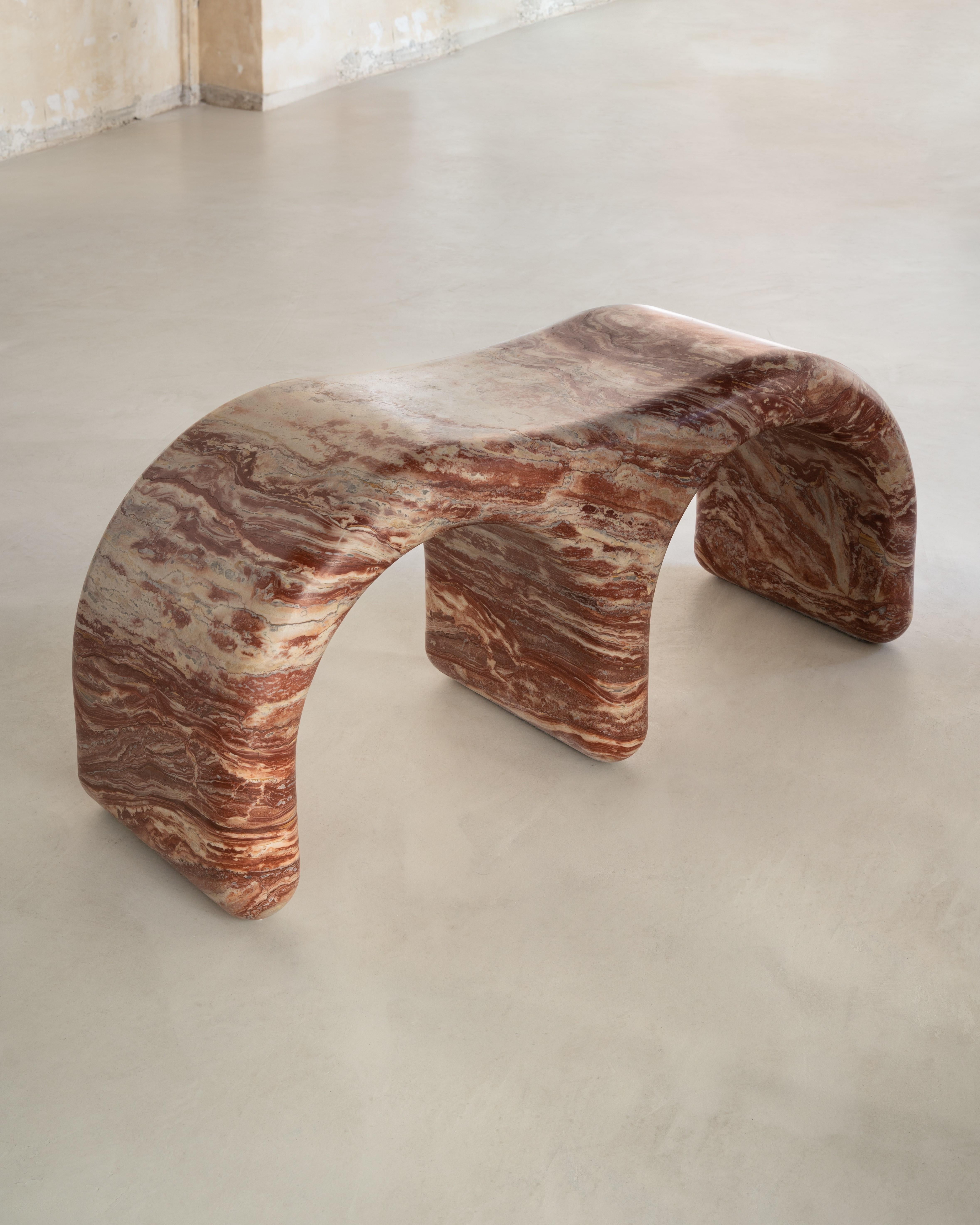 A comfortable bench made with Serafini's luxurious marble. A natural material in an unnatural shape. Designed by Herve Langlais, the Aime Bench conveys feelings of strength, stability, and comfort. Moreover, its natural material that is marble looks