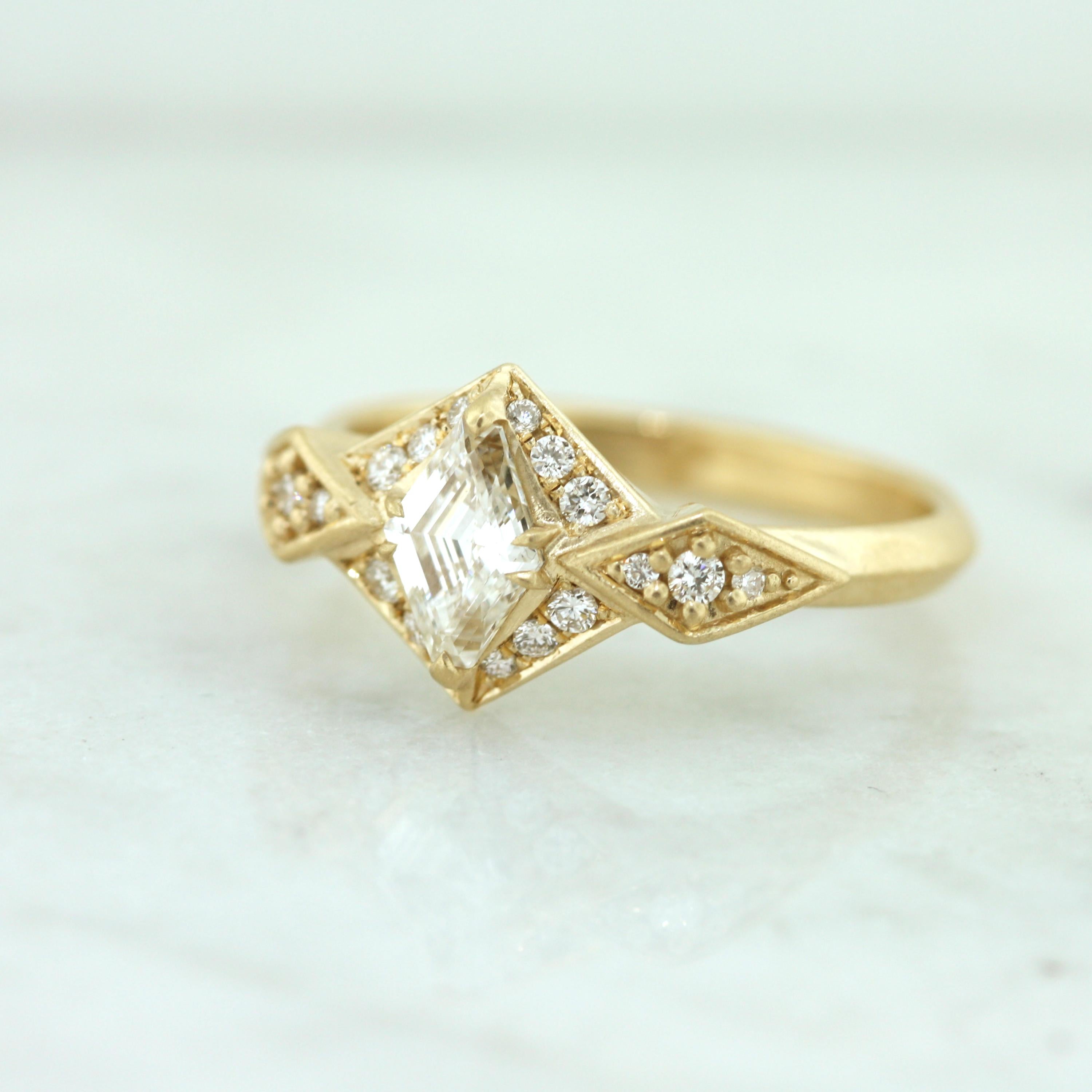 Geometric Art Deco inspired ring with a .75 carats of Canadian diamonds set in 100% recycled 14K yellow gold. Perfect for the modern lady who likes traditional materials but loves contemporary design.

- One of a kind
- Finger size 6.25
- Available