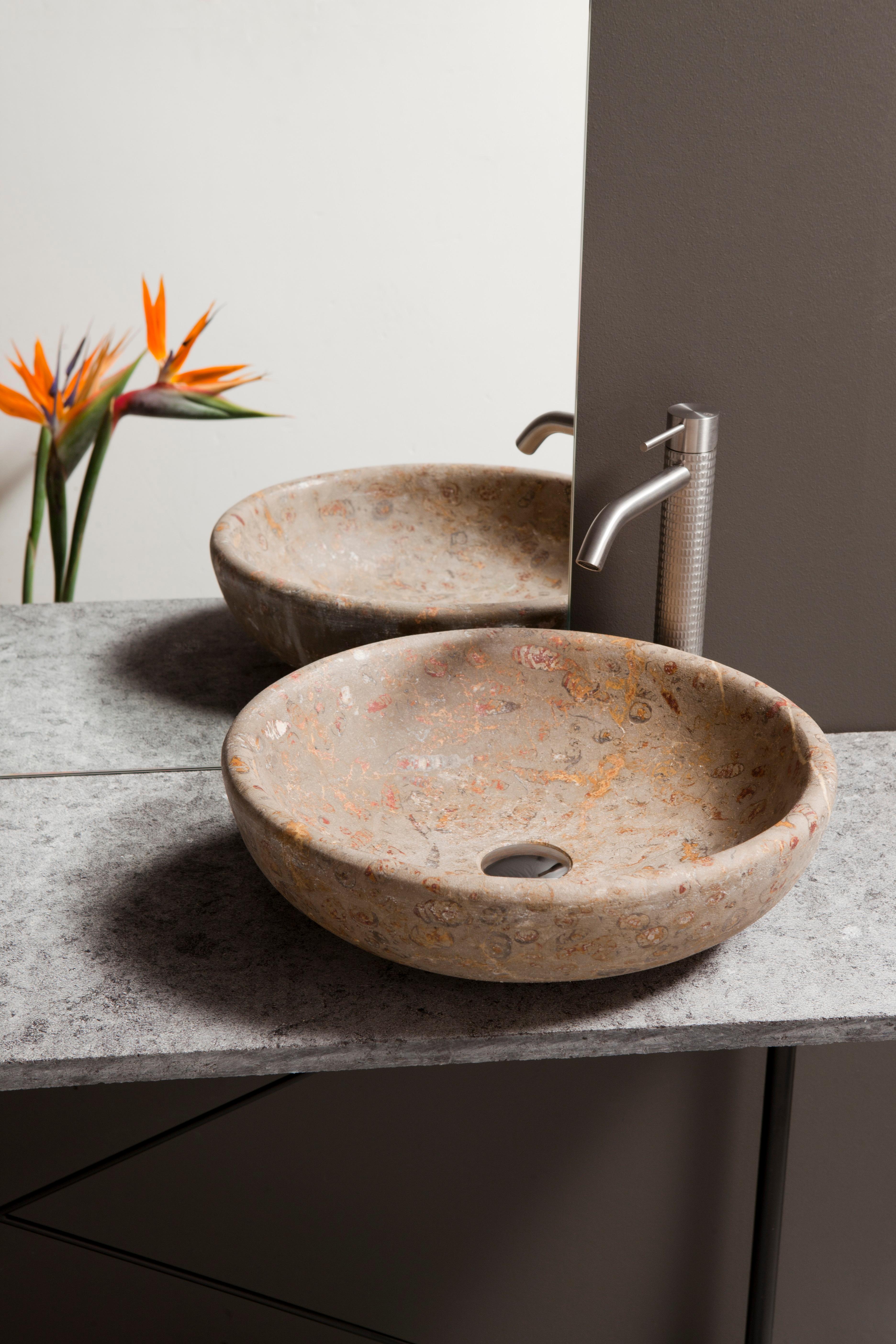 Leda sink sculpted from a solid piece of Jurassic Marble, with Nerineas fossils, in raw finish. Designed by AINA and manufactured by NERINEA in our factory located in Valencia (Spain). 
All Aina’s products are delivered with a certificate of
