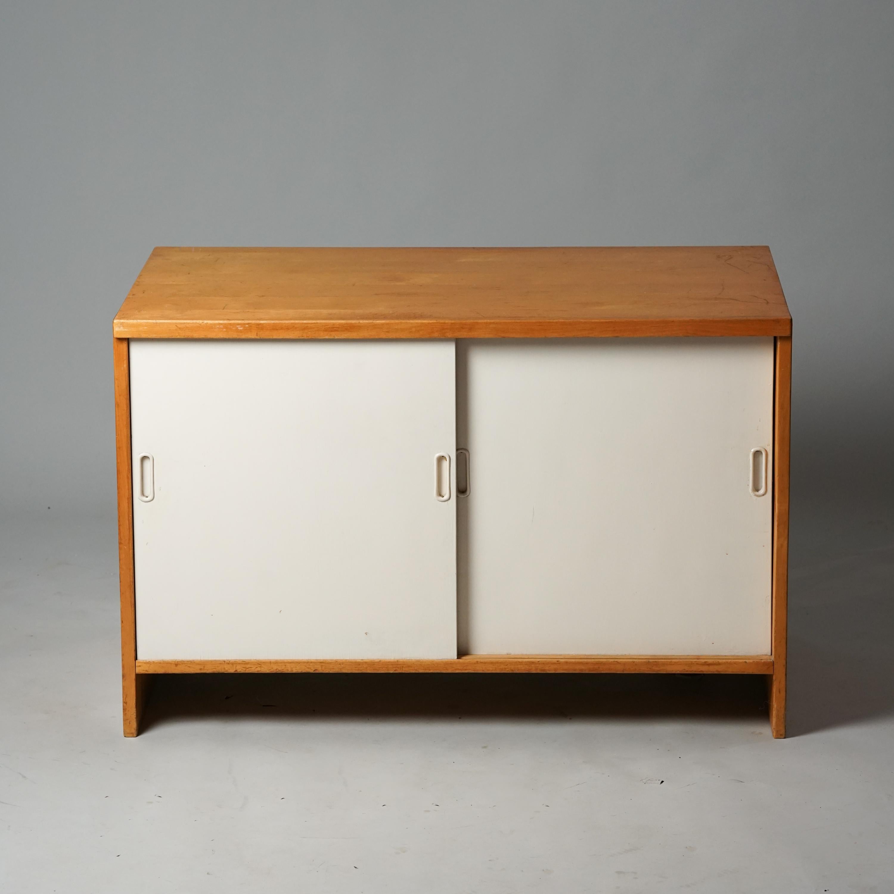Cabinet Model 216, designed by Aino Aalto, manufactured by Oy Huonekalu- ja Rakennustyötehdas Ab, 1940s. Birch and painted birch. Good vintage condition, patina and minor wear consistent with age and use. 

Aino Aalto (1894-1949) was an architect,