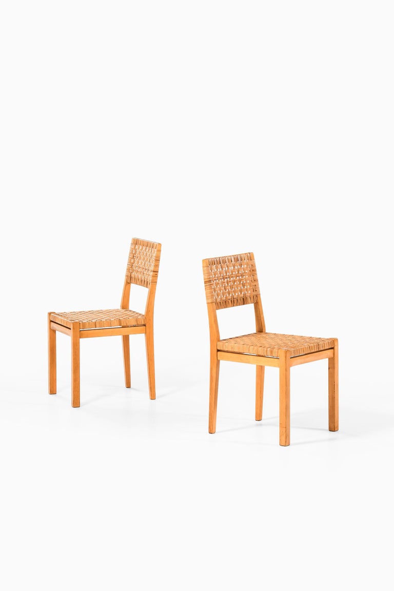 Rare pair of dining chairs model 615 designed by Aino Aalto. Produced by Artek in Finland.
 