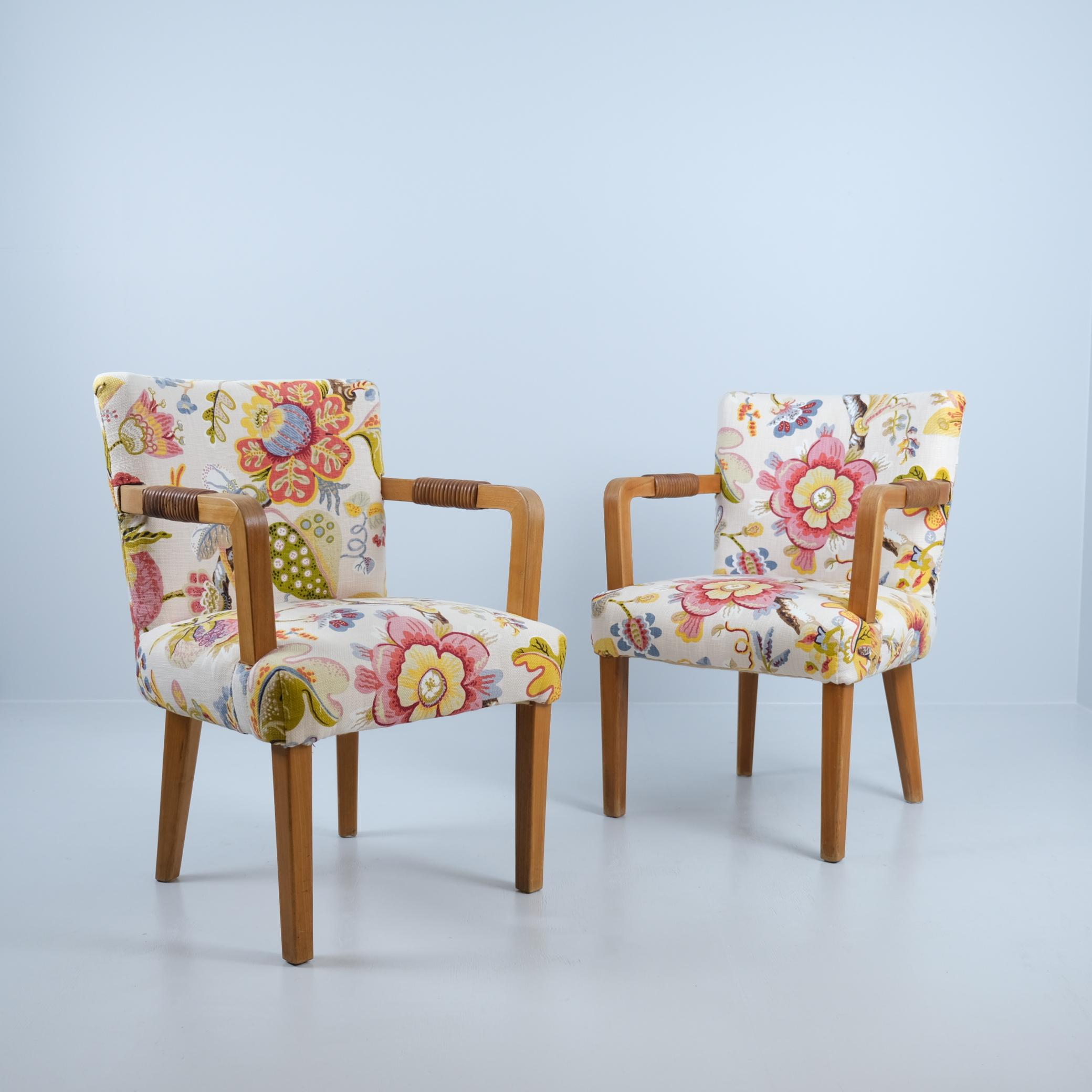 A rare pair of mid-century Aino Aalto club chairs from the 1930s-40s manufactured by Huonekalu- and Rakennustyötehdas for Artek. The chairs are made of oak and feature a beautiful brown natural leather wrap on each arm rest for added comfort and