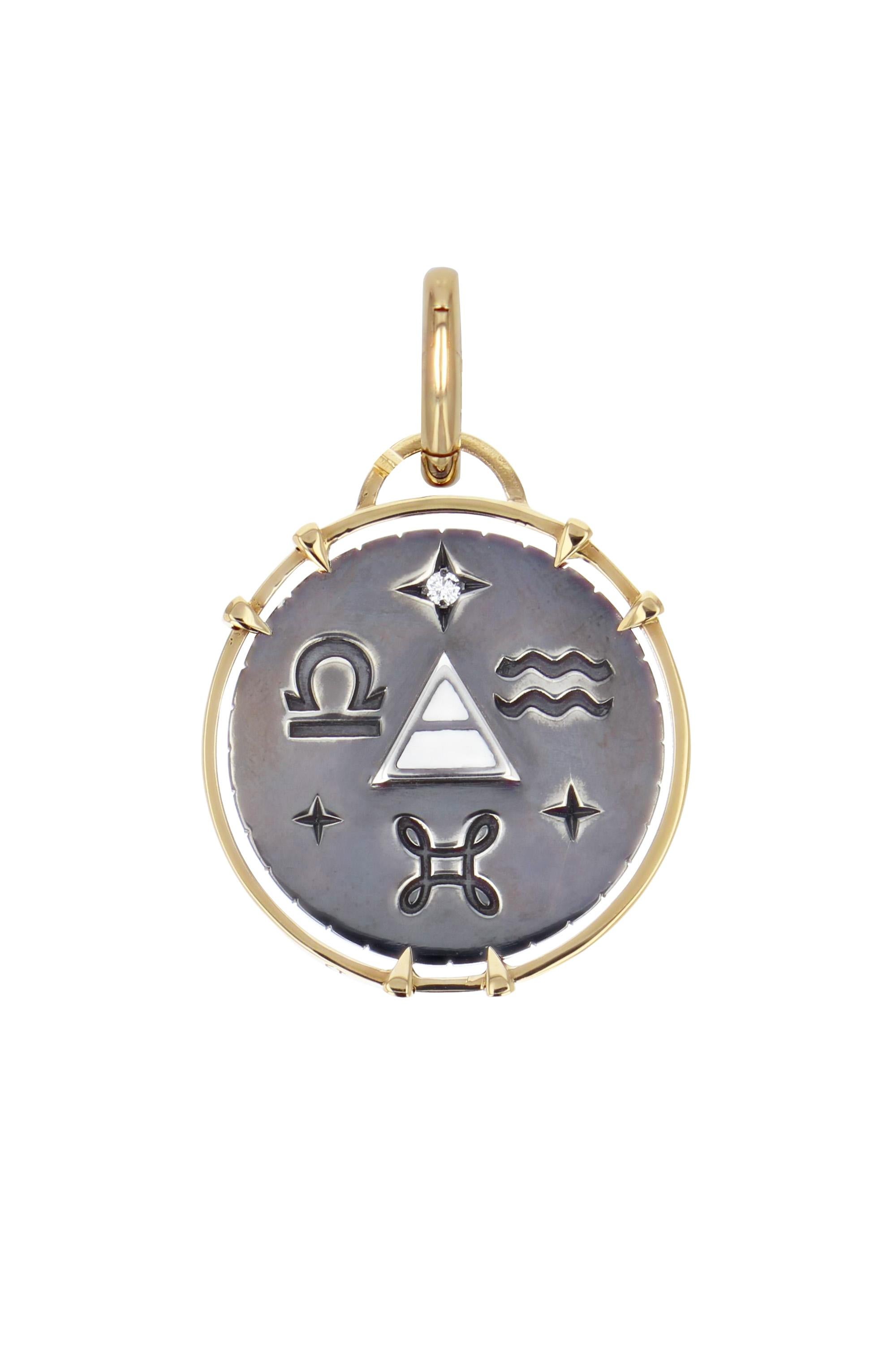 Yellow gold and distressed silver charm. Studded with a diamond, the charm embraces all the symbols linked to the Air sign with a gold spade on its front and the alchemy triangle surrounded by its zodiac signs  (Libra, Gemini, Aquarius) on its