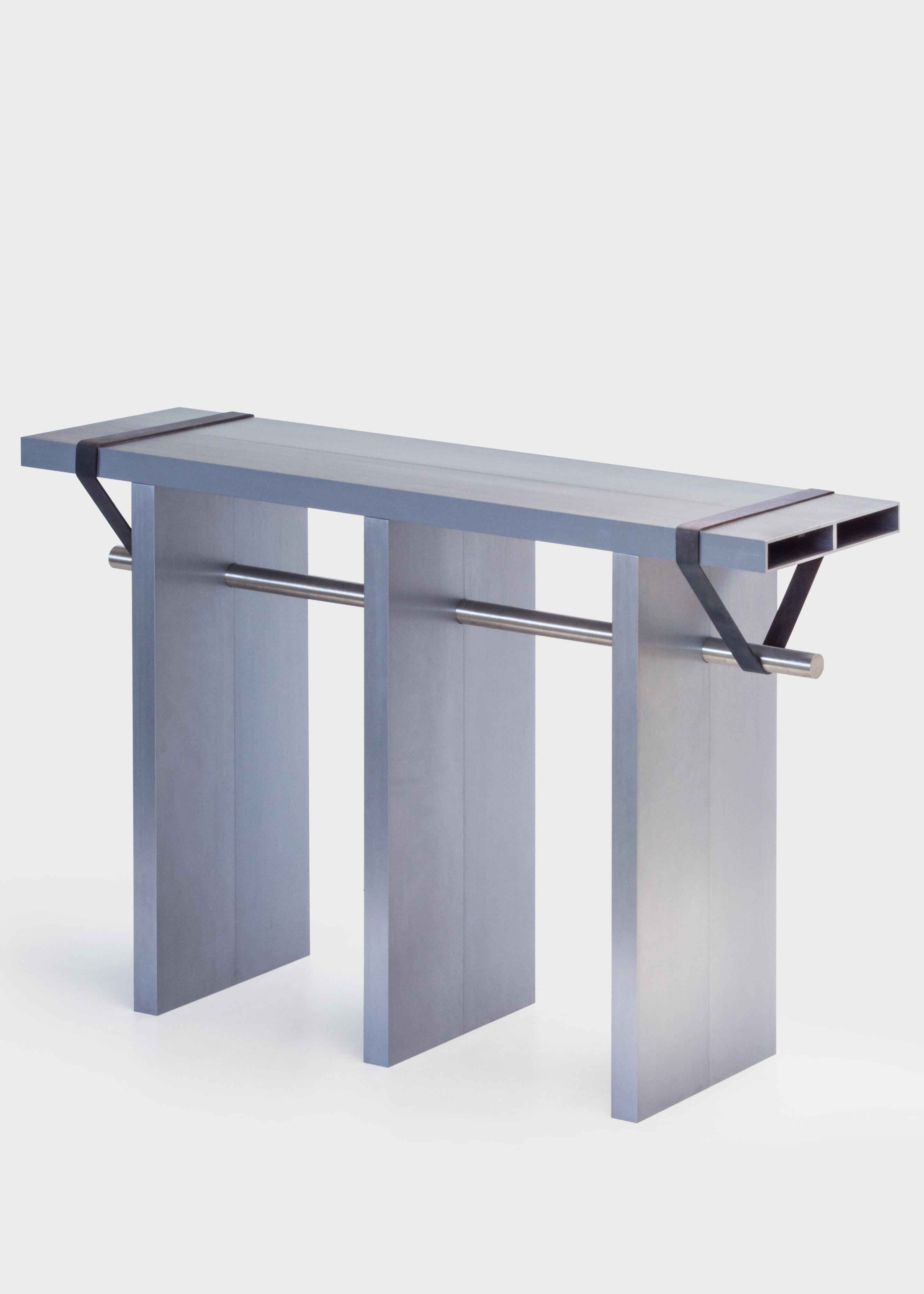 Arke
Console
Aluminum, stainless steel,
Rubber
Measures: H 75, L 120, W 30 cm
Approximate 40kg
Limited Edition of 25

Arke is a radical composition made out of eight brushed and anodized aluminum profiles. The profiles are bolted two by two