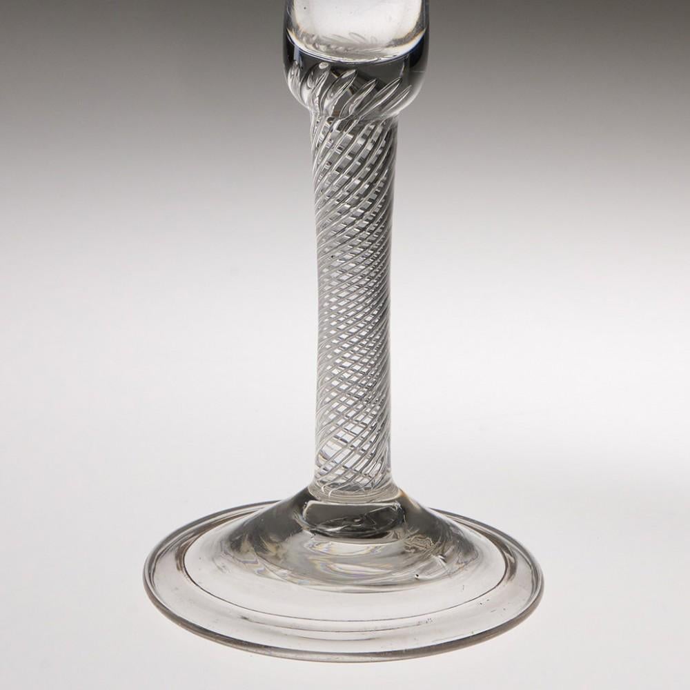 Heading : Air twist stem Georgian wine glass
Period : George II - c1750
Origin : England
Colour : Clear
Bowl : Bell
Stem : Multi spiral air twist
Foot : Folded conical
Pontil : Snapped
Glass Type : Lead
Size :  17.1cm height, 6.7cm diameter bowl,