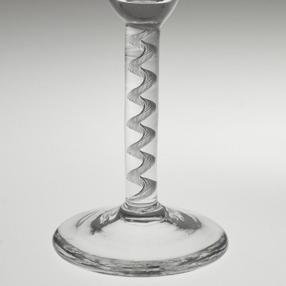 Heading : Air twist stem Georgian wine glass
Period : George II - c1750
Origin : England
Colour : Clear
Bowl : Round funnel
Stem : A multi ply air twist corkscrew
Foot : Conical
Pontil : Snapped
Glass Type : Lead
Size :  14.3cm height, 5.2cm