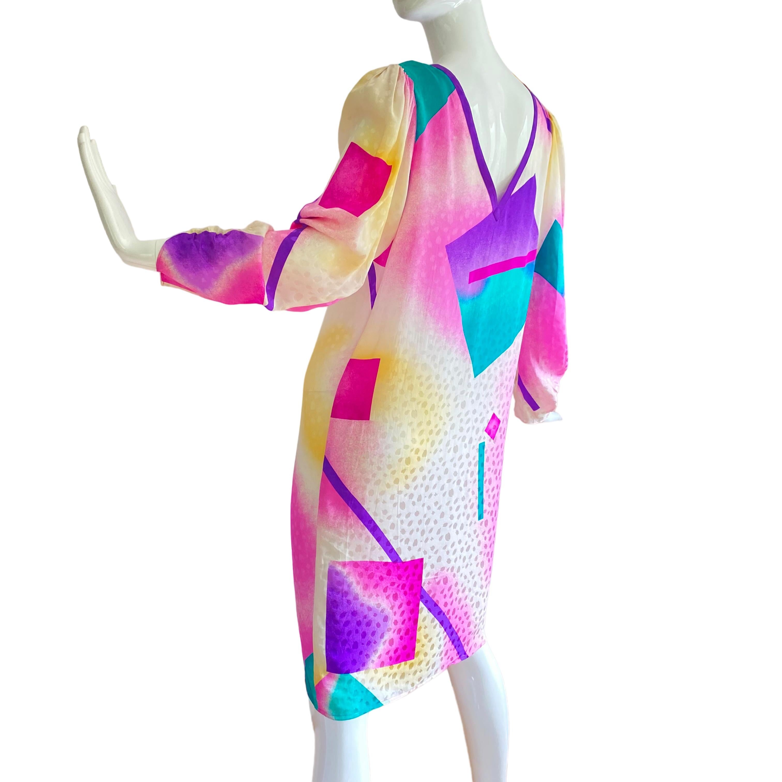 Style: Flora Kung Fiona dress.
Fabric: 100% silk petal jacquard.
Print: Airbrushed splash paint in pink, purple, aqua, and yellow on white. Puff long sleeves. Neckline trimmed in purple silk. 
Approximately 40