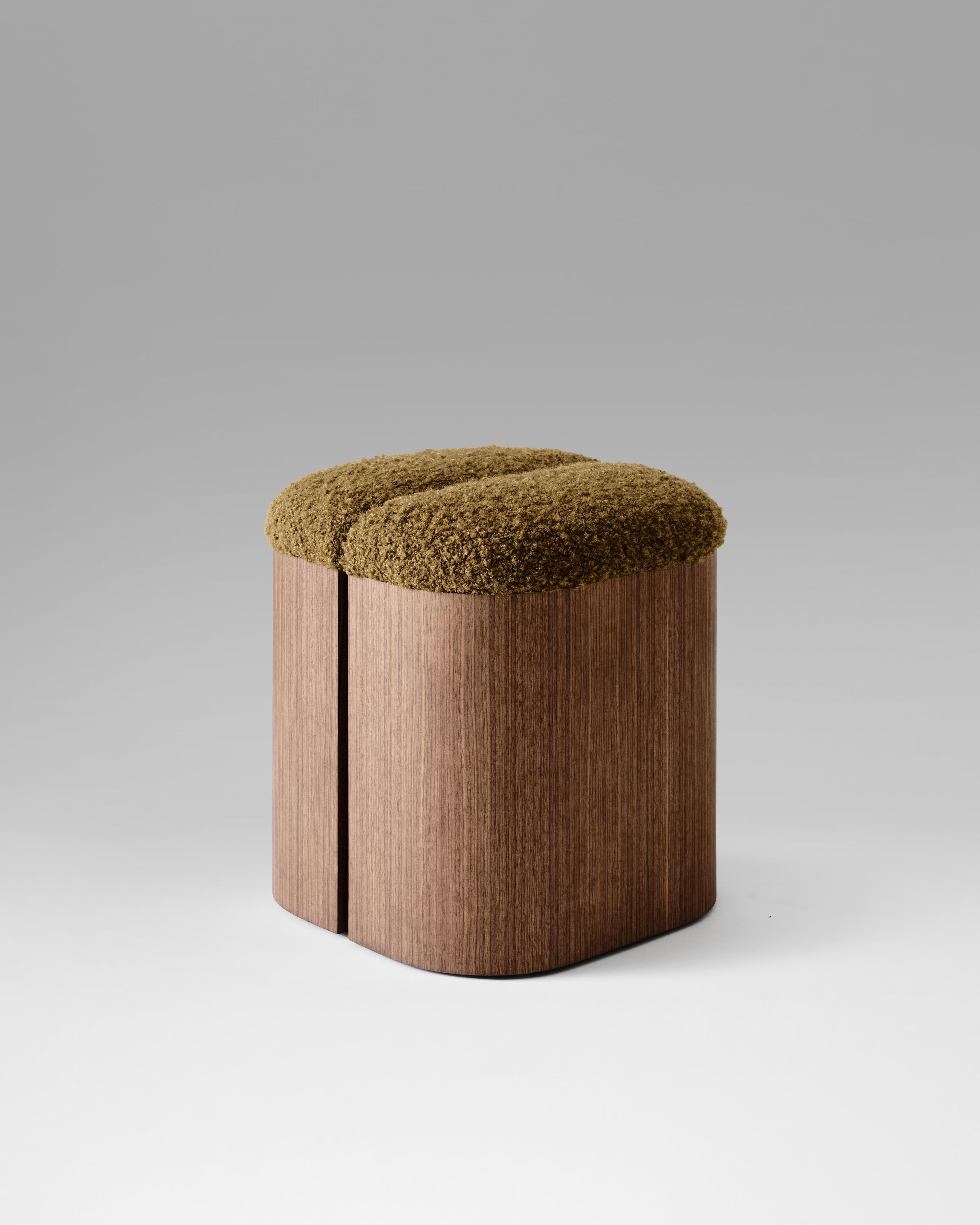 The Aire Stool embraces the relationship between space and form, using open areas to inspire a sense of connection between its elements. A handcrafted wooden base provides solid support for the gently curved, upholstered seat, blending structure