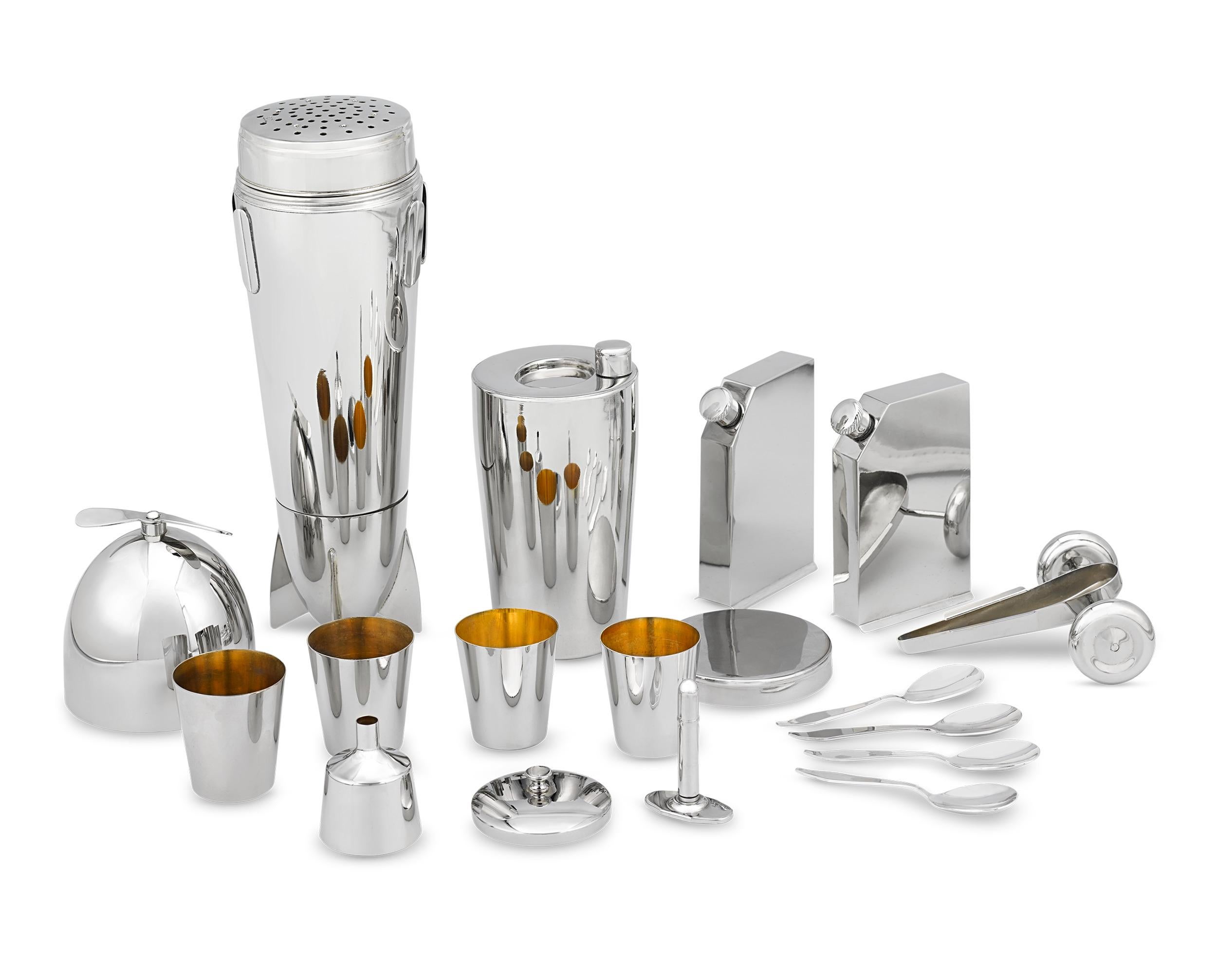 Crafted in 1928, this striking silver-plated cocktail shaker set by J.A. Henckels features two detachable flasks at the wings. Designed with burgeoning aviation in mind, this traveling airplane-shaped cocktail set includes all the necessary tools to