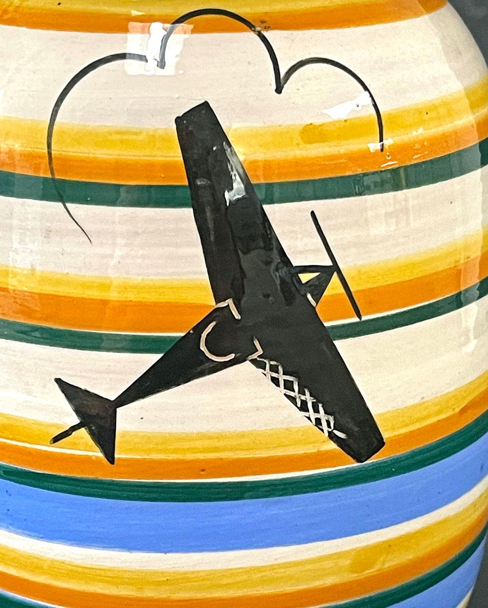 A very fine and rare example of Italian decorative arts in the Futurist mold, celebrating aeronautics, speed and modern technology, this vase was made by the famed Rometti ceramic works in Umbertide, Italy, not long after it was founded in 1927.