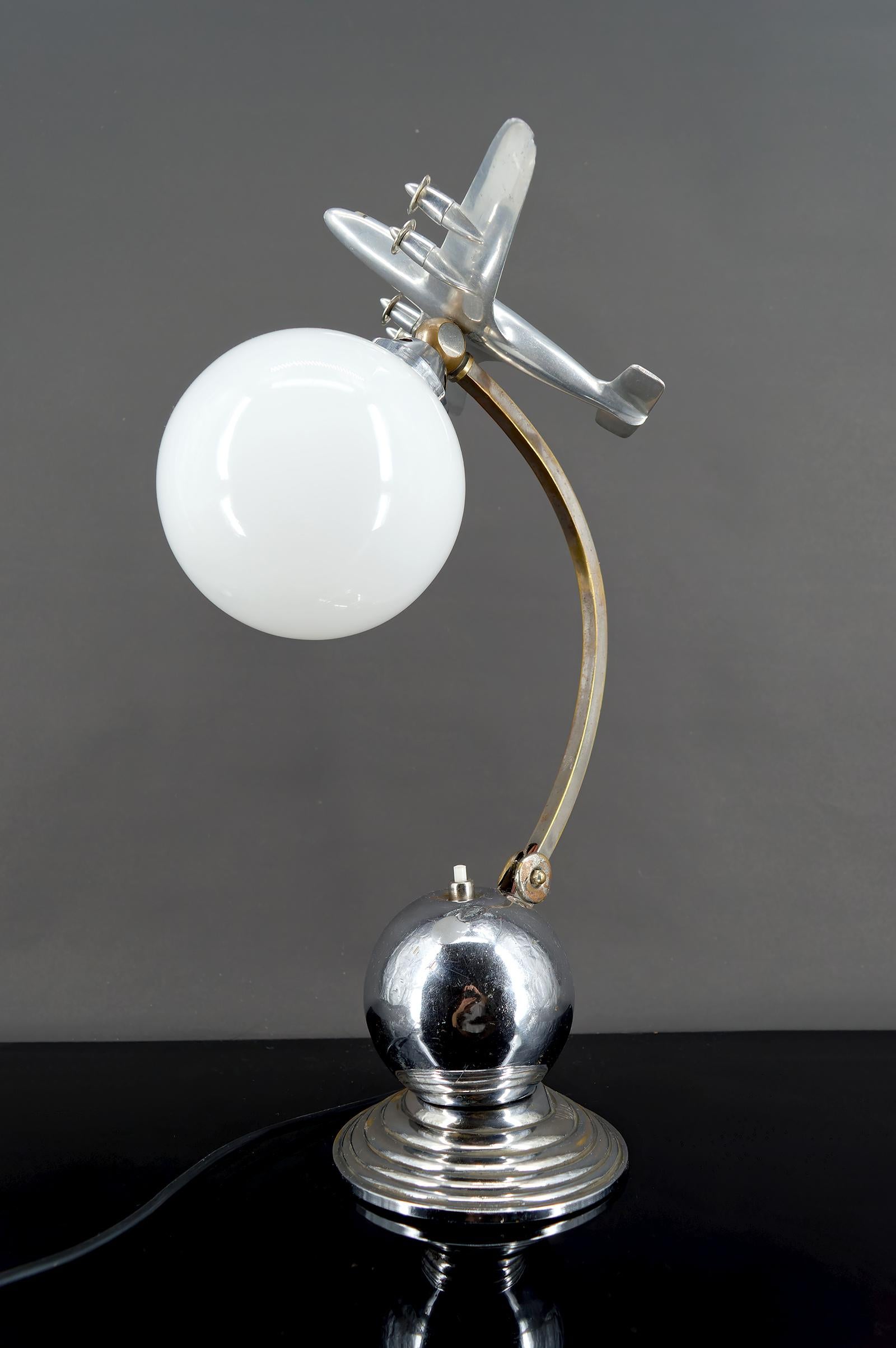 Airplane  Lamp — Chrome & Aluminum
Art Deco / Streamline Moderne – Circa 1930–1940

An iconic piece of 1930s industrial design, this “Airplane” lamp perfectly embodies the Streamline Moderne style—a sleek, futuristic evolution of Art Deco