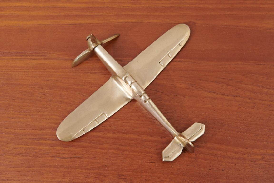 Restored: Airplane model Spitfire England 1940, handmade, solid polished brass, the aircraft can be removed from stand, rotatable propeller, for decoration or for playing

Note: The Spitfire was the most famous and beautiful fighter of the WW2