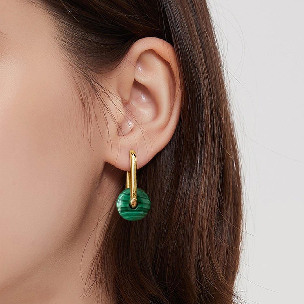 Simultaneously refined and rebellious, these Jullie big oval earrings are inspired by the unisex style in Amsterdam, add modern edge to any look.

- 18K gold plated sterling silver
- Green malachites, size 15mm
- Earrings total length 25mm
- The