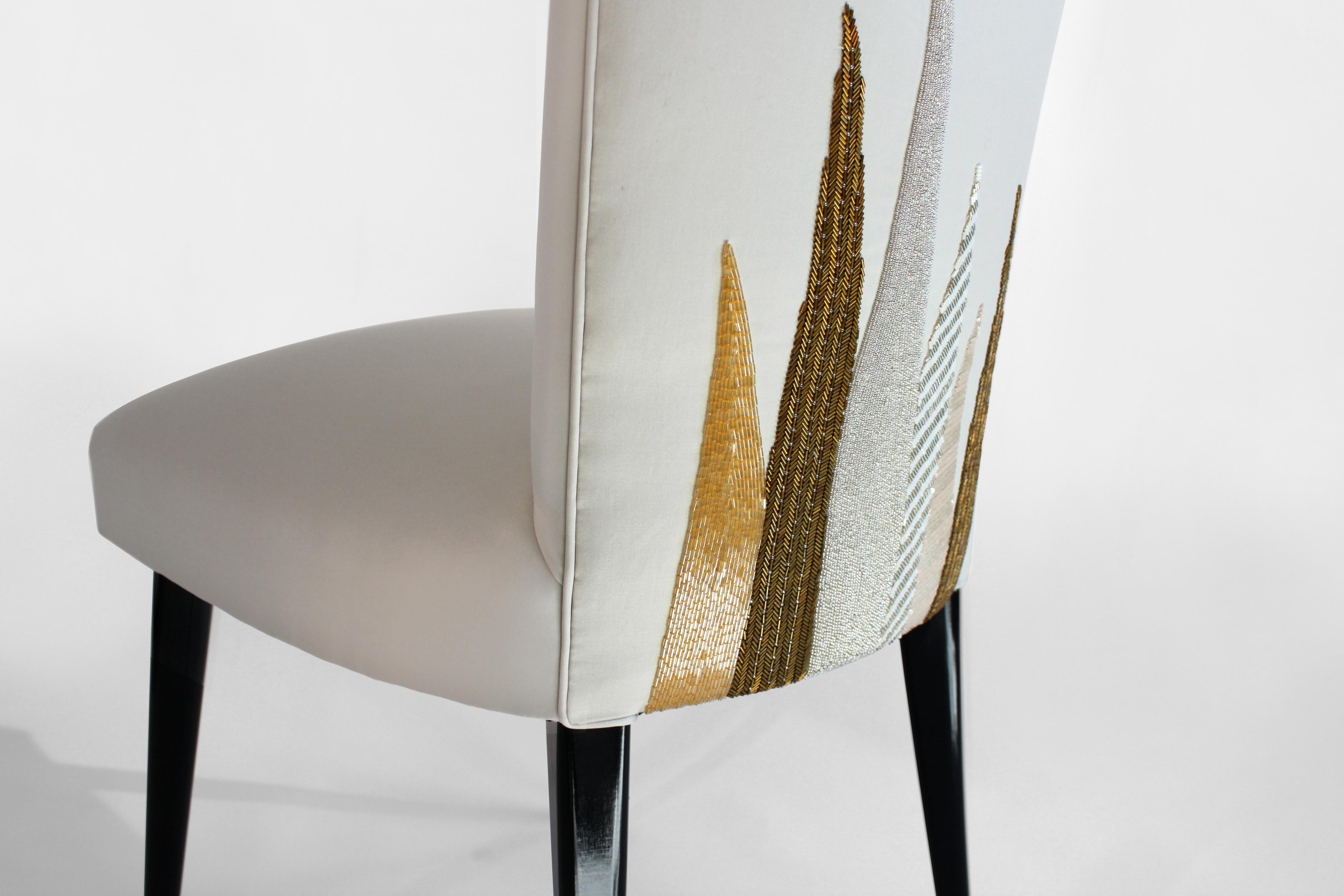 Inspired by a vintage Italian silhouette from the 1950s, this elegant slipper chair is designed and individually upholstered in our London studio. Hand beaded and embroidered in soft gold and bronze metallic hues. 

The chair frame is constructed