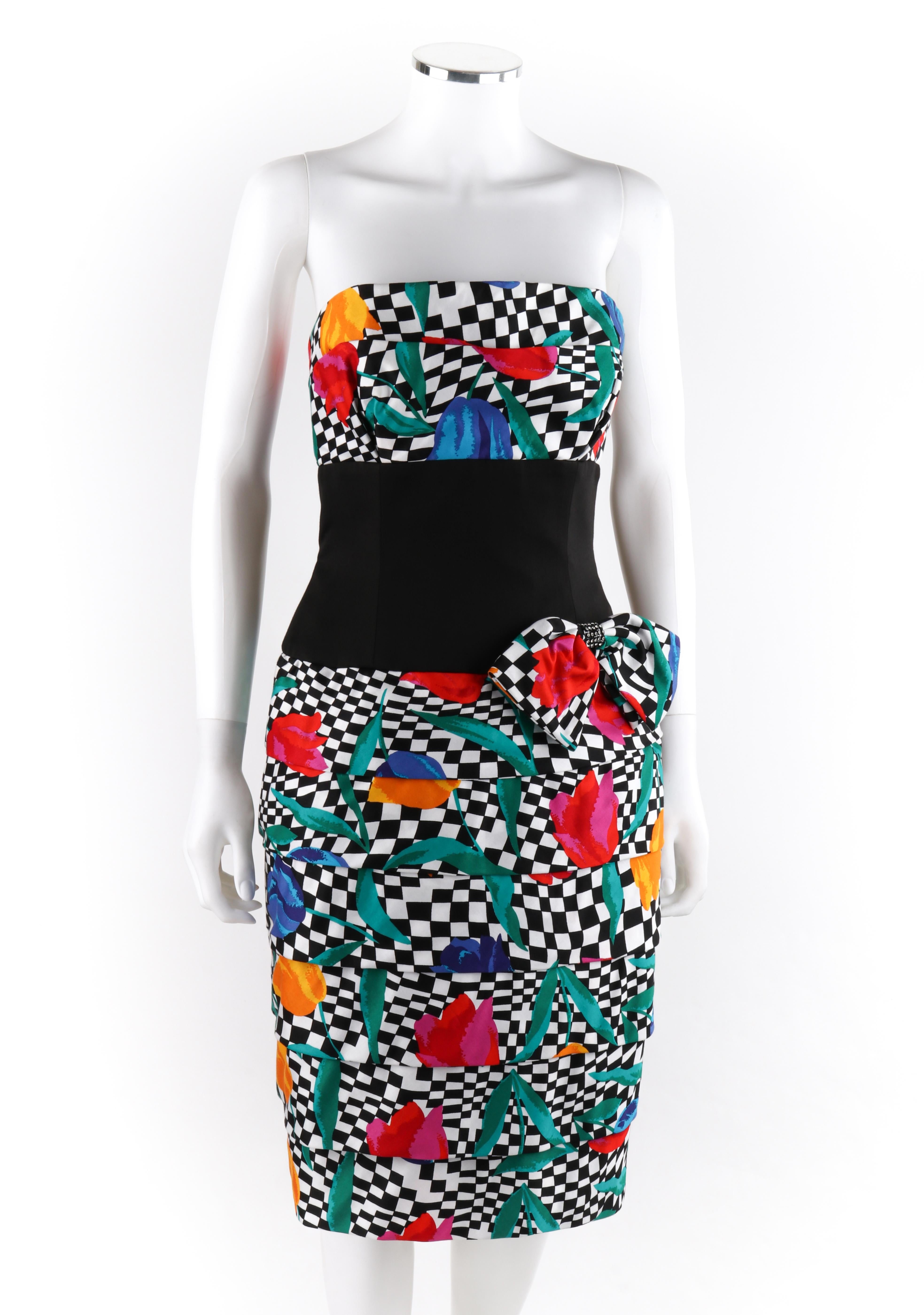 AJ BARI c.1980’s Tiered Op Art Pop of Tulip Floral Check Party Dress

Circa: 1980’s
Label(s): Aj Bari
Designer: Kay Unger
Style: Tiered Party Dress
Color(s): Shades of black, white, green, blue, red, pink and yellow
Lined: Yes
Marked Fabric Content: