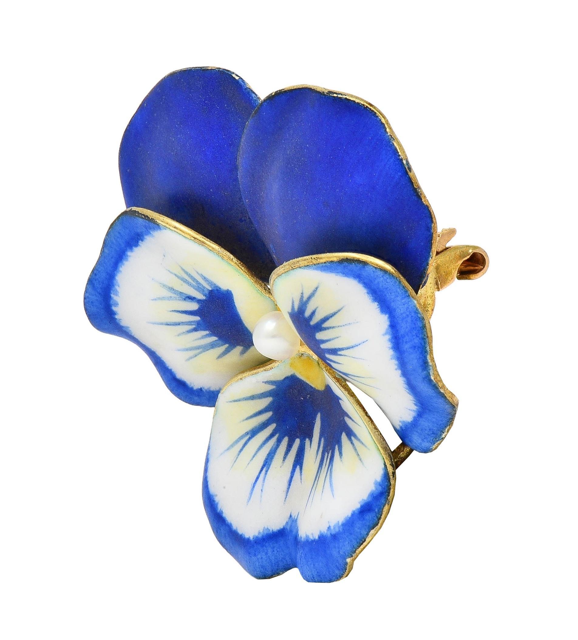 Designed as a dimensional pansy flower painted with enamel 
Opaque white, blue, and yellow with minimal loss 
Centering a 3.0 mm round pearl
White with subtle iridescence
Completed by hinged pinstem with locking closure 
Stamped for 14 karat gold