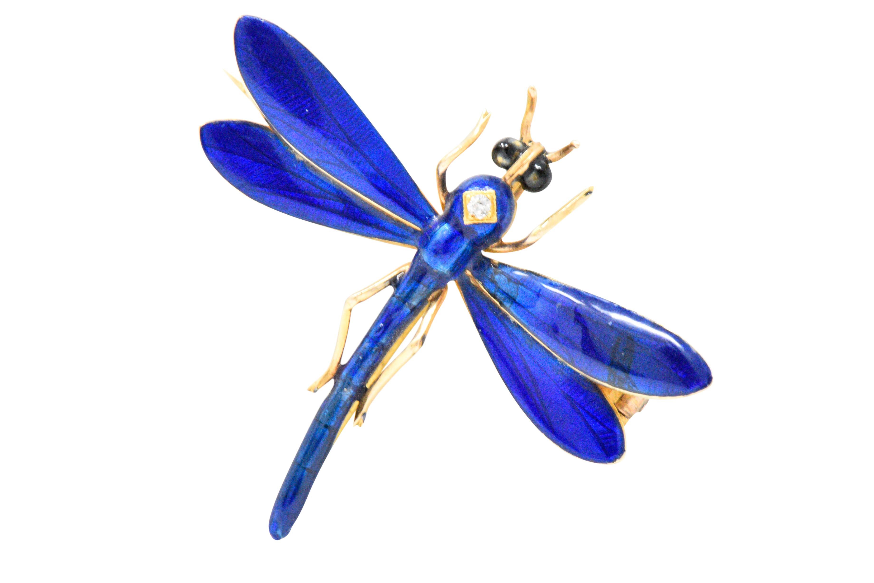 Designed as a dragonfly with an old mine cut diamond set in the center of it's body, weighing approximately 0.01 carats total

Bright blue enamel body and wings with black enamel eyes in lush 14k gold

Just delightful and whimsical

Maker's mark for