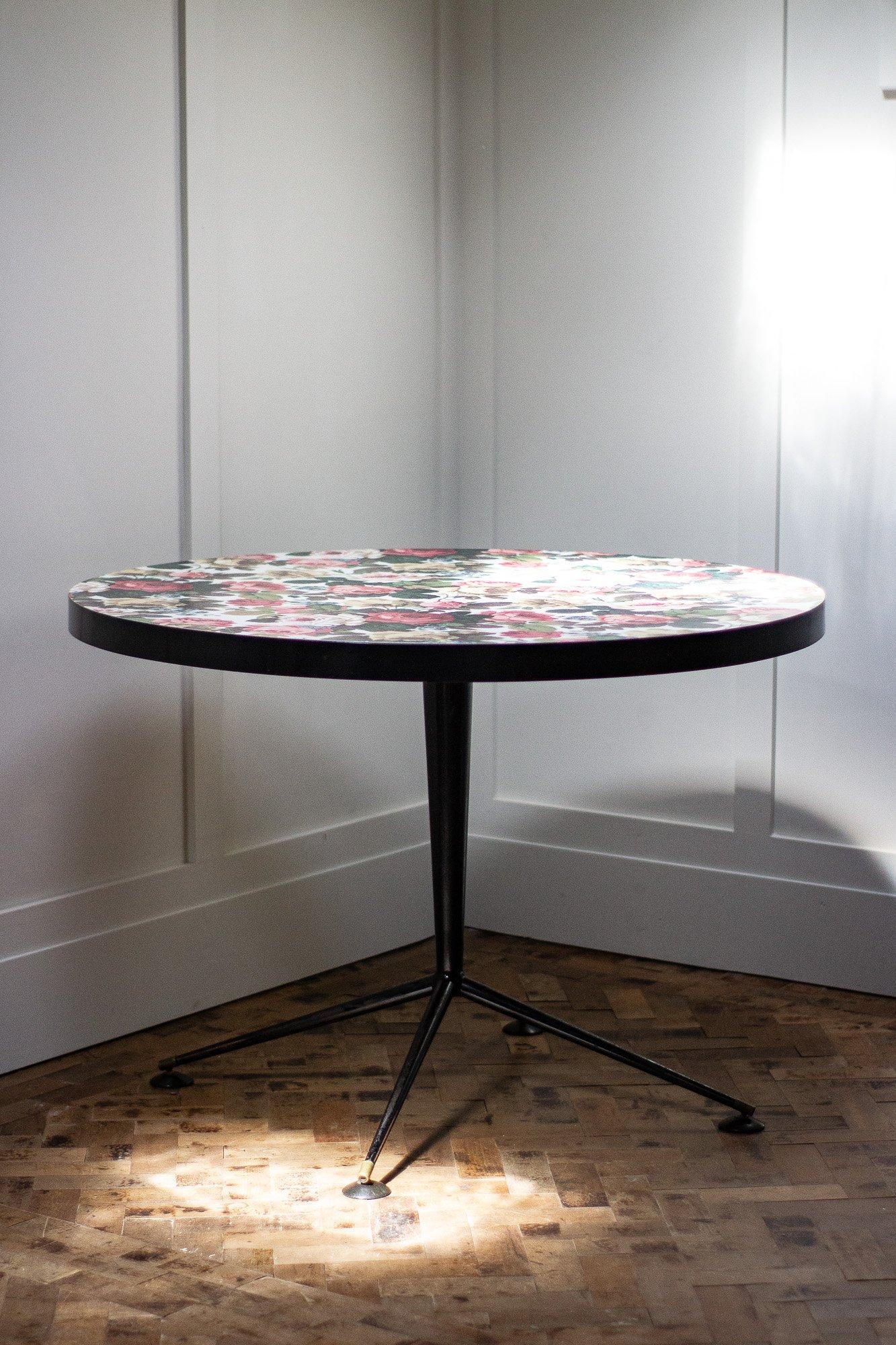 This extremely rare table designed by A.J Milnes for Heals is circa 1950s.

Totally original with no damage to the formica top. 

English made.

Measures: Height 75cm

Width 106cm.
