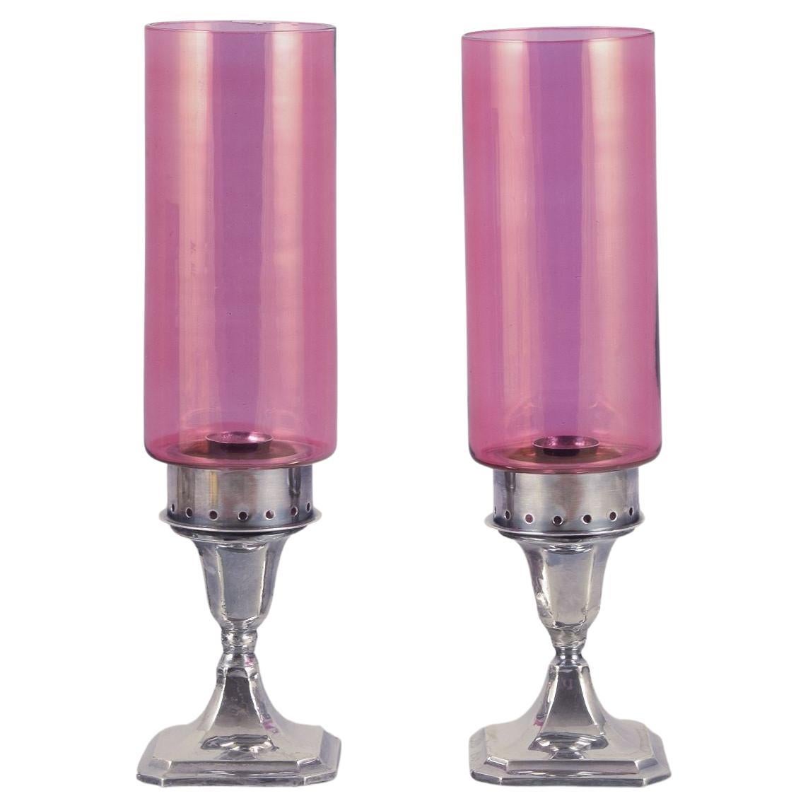 A.J. Pepper & Co. Pair of "Hurricanes" candlesticks in silver and violet glass