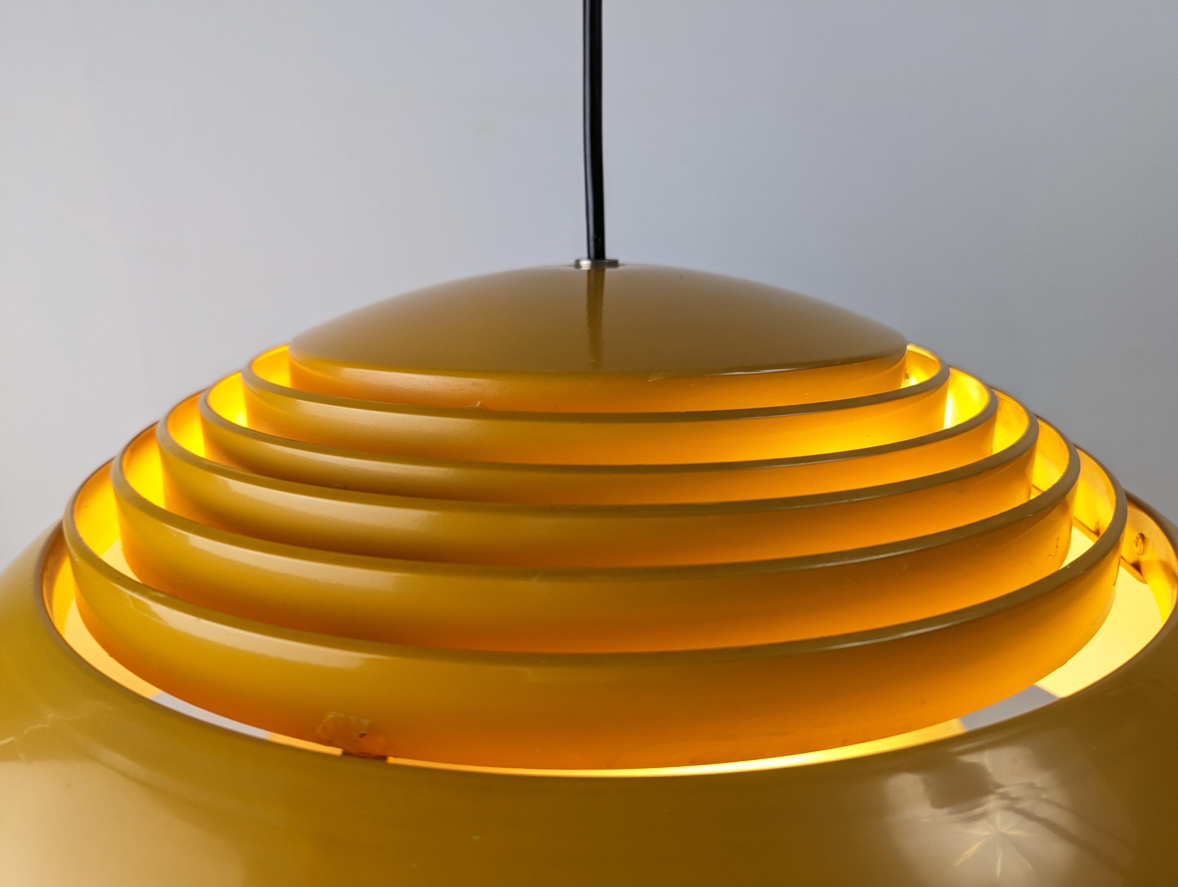 AJ Royal pendant lamp from the 60s in yellow, the most exclusive and scarce of its production designed by Arne Jacobsen and produced by Louis Poulsen for the SAS Royal Hotel in Copenhagen, the AJ Royal is an icon that follows the general concept of
